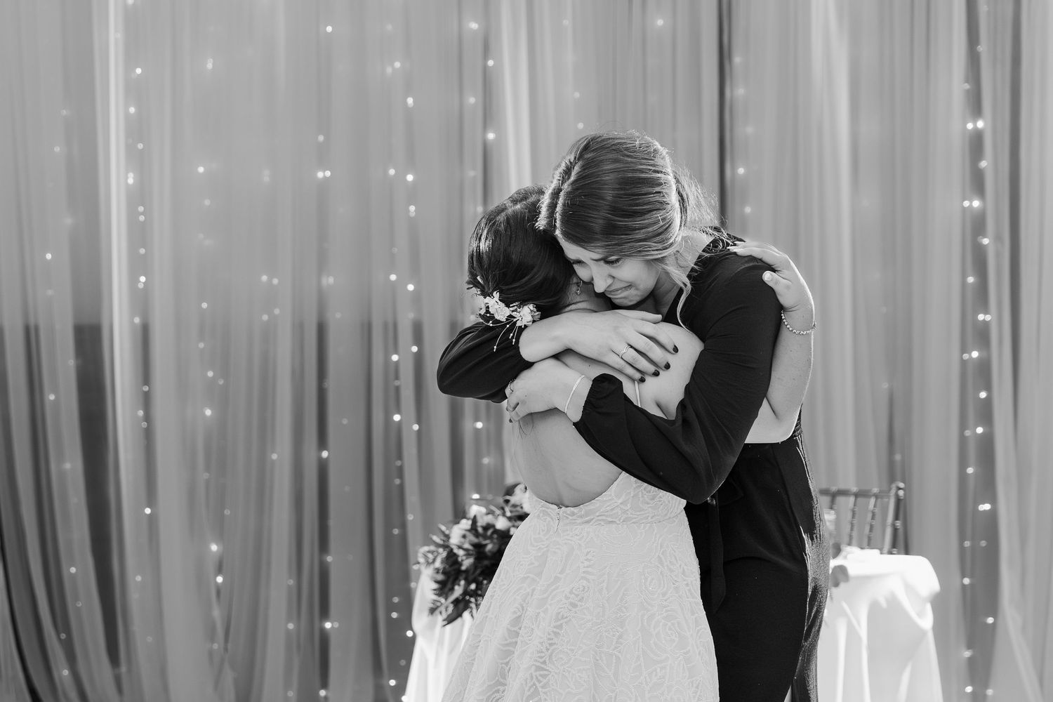 Bride hugging a family member on her wedding day at the old courthouse in London, Ontario