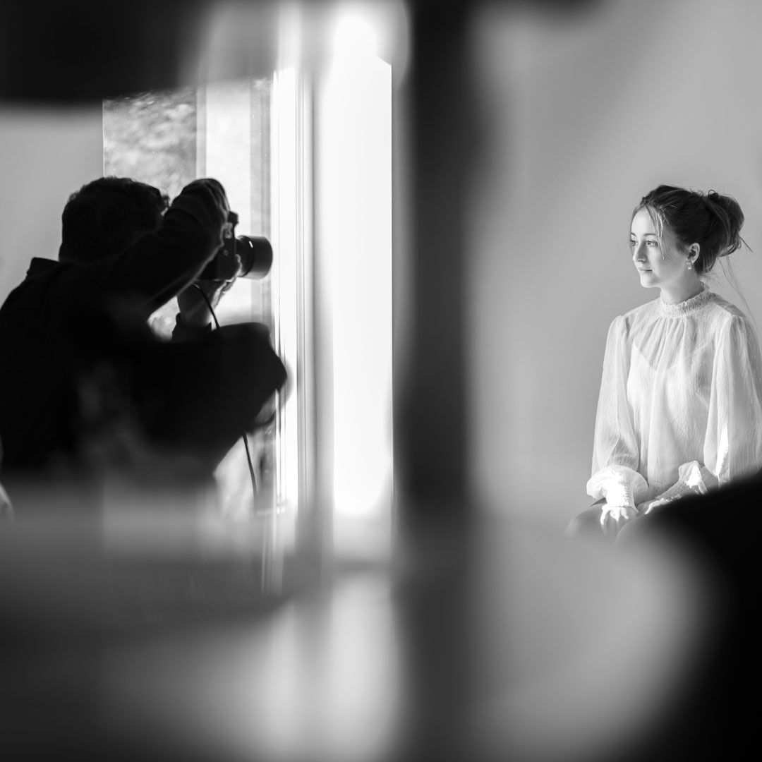 Portrait of Roj Whitelock Photographer showing silhouettes of a person near a bright window in different poses.