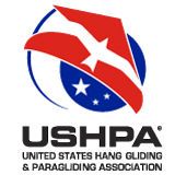 Red and blue circular logo design for USHPA (United States Hang Gliding and Paragliding Association) with white star details.