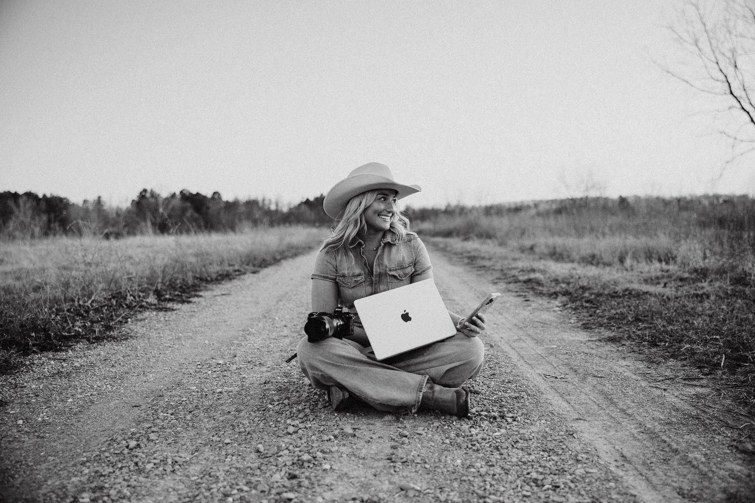 Photographer posing with camera, showcasing their passion for capturing memorable moments and stunning images.