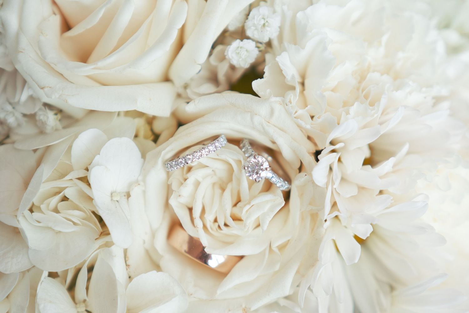 Floral arrangement with wedding bands. Cincinnati wedding Ohio Photographer