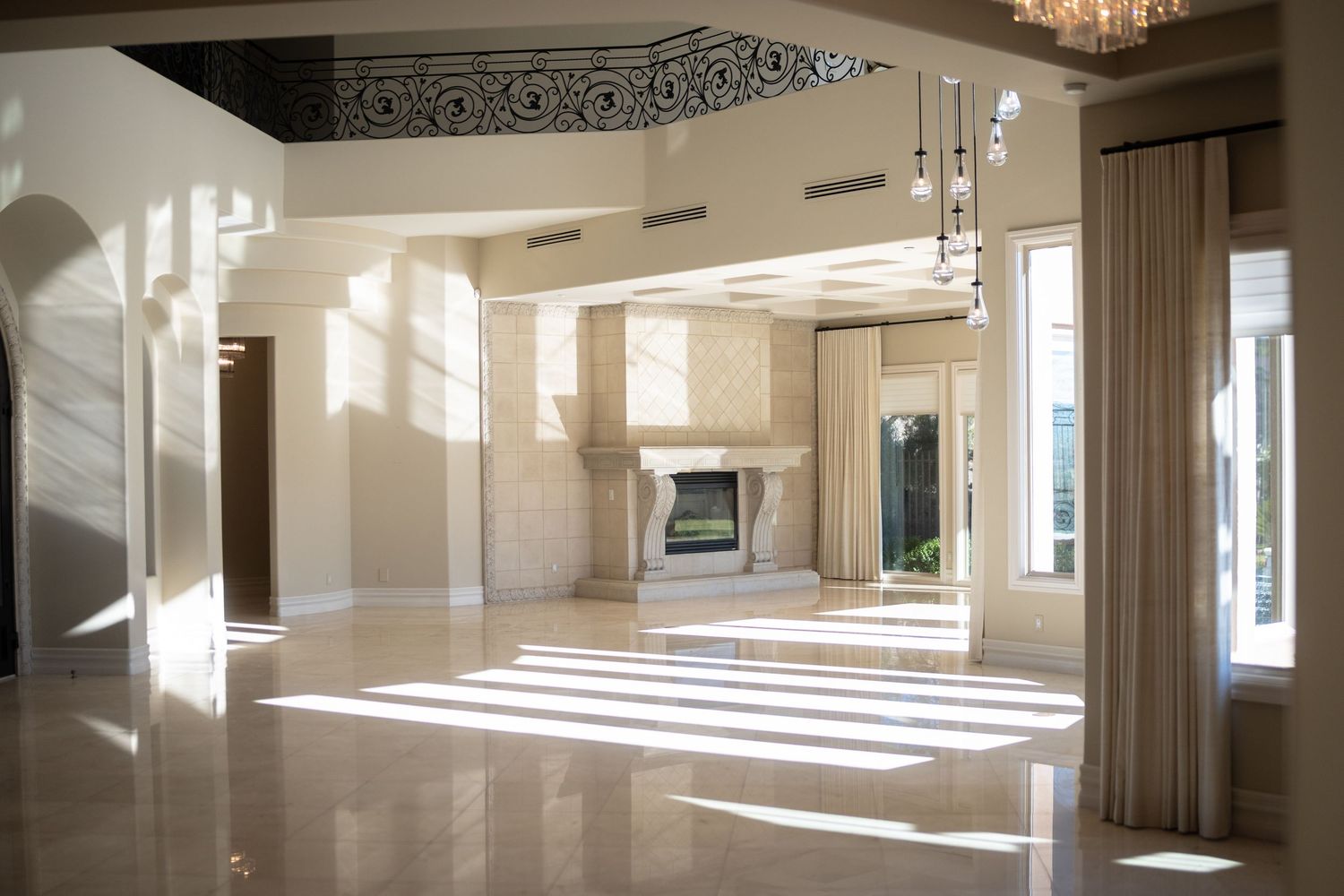 Spacious event venue with polished floors and dramatic lighting effects.