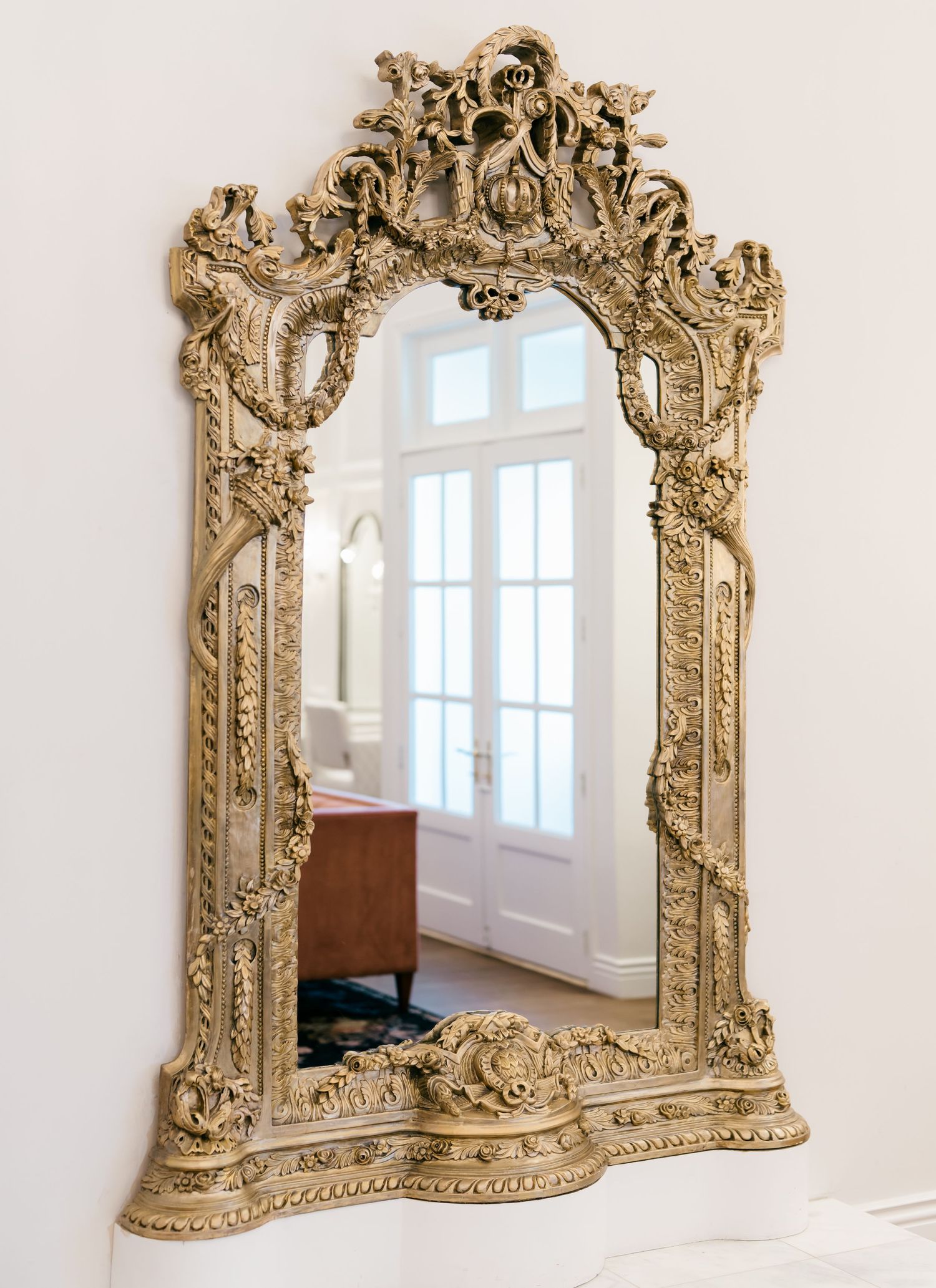 Ornate vintage gold baroque mirror with intricate floral carvings and scrollwork details shown from multiple angles.