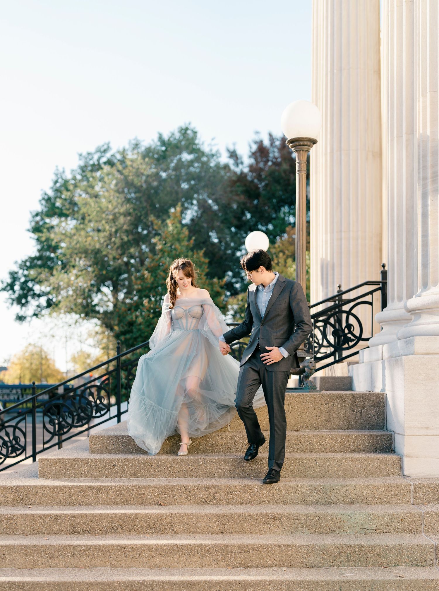 A romantic wedding couple poses on grand stone steps with white columns, captured in a sequence of four artistic shots.