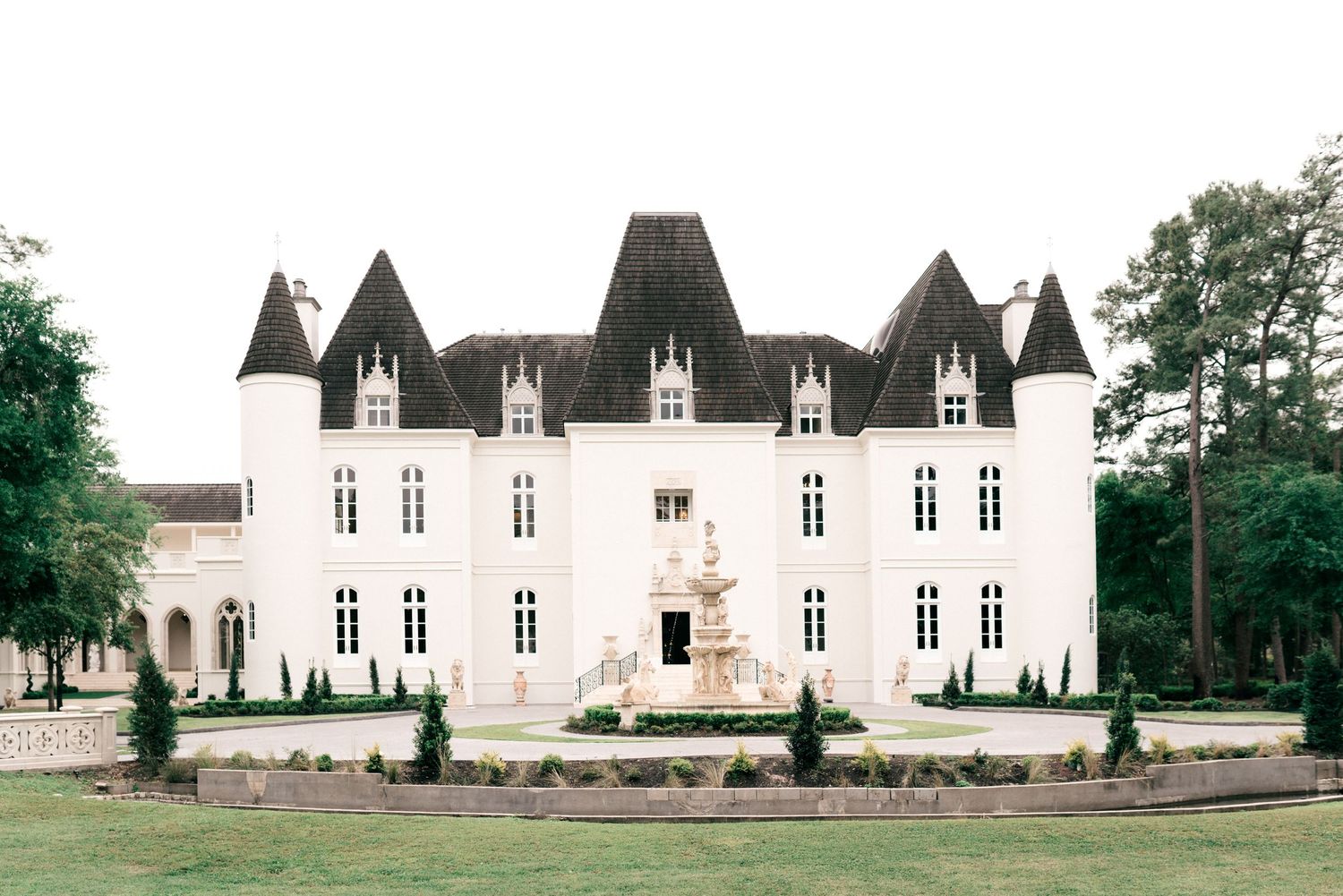 A full exterior view of Chateau Nouvelle in Houston, Texas. A French chateau inspired, castle wedding estate.