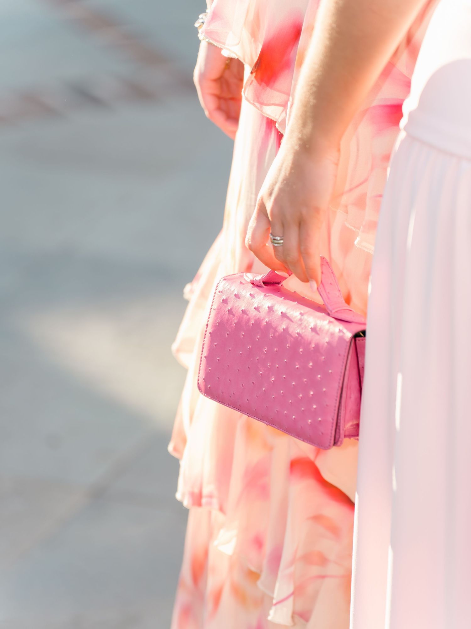 Pink clutch purses and delicate details from a wedding celebration.