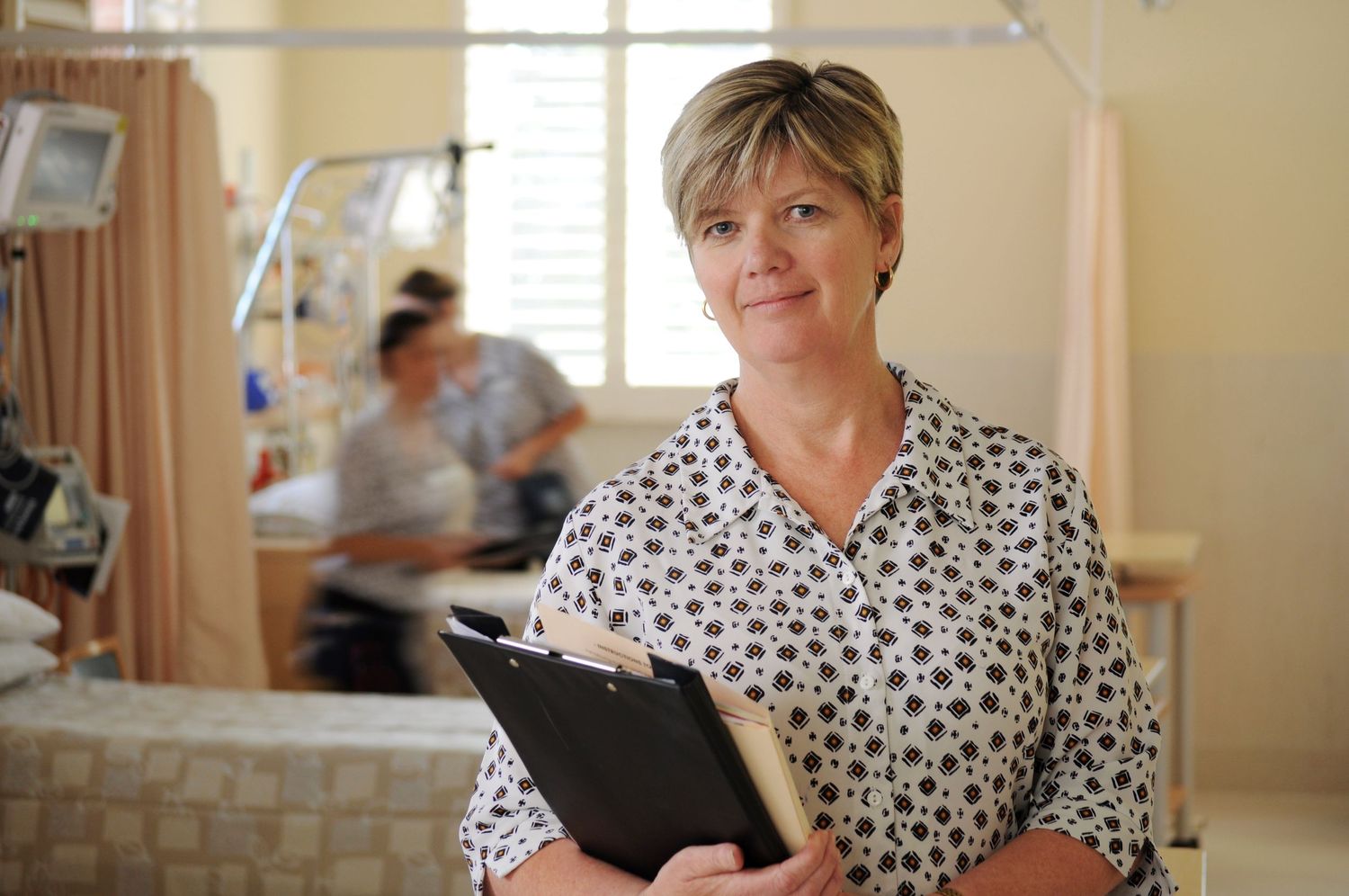 Commercial Photo - Nurse in Shared Patient Room