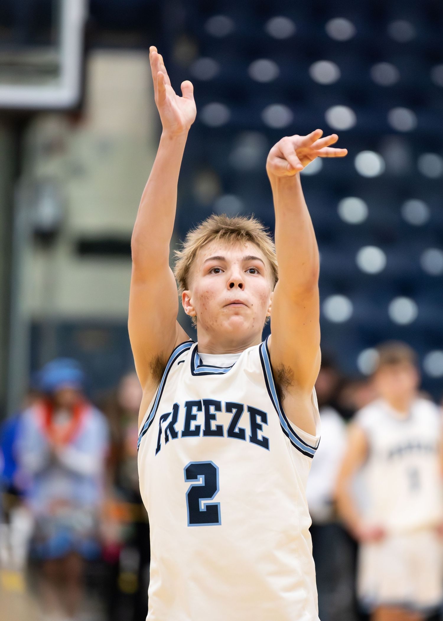 Young basketball player number 2 in Freeze uniform shoots the ball.