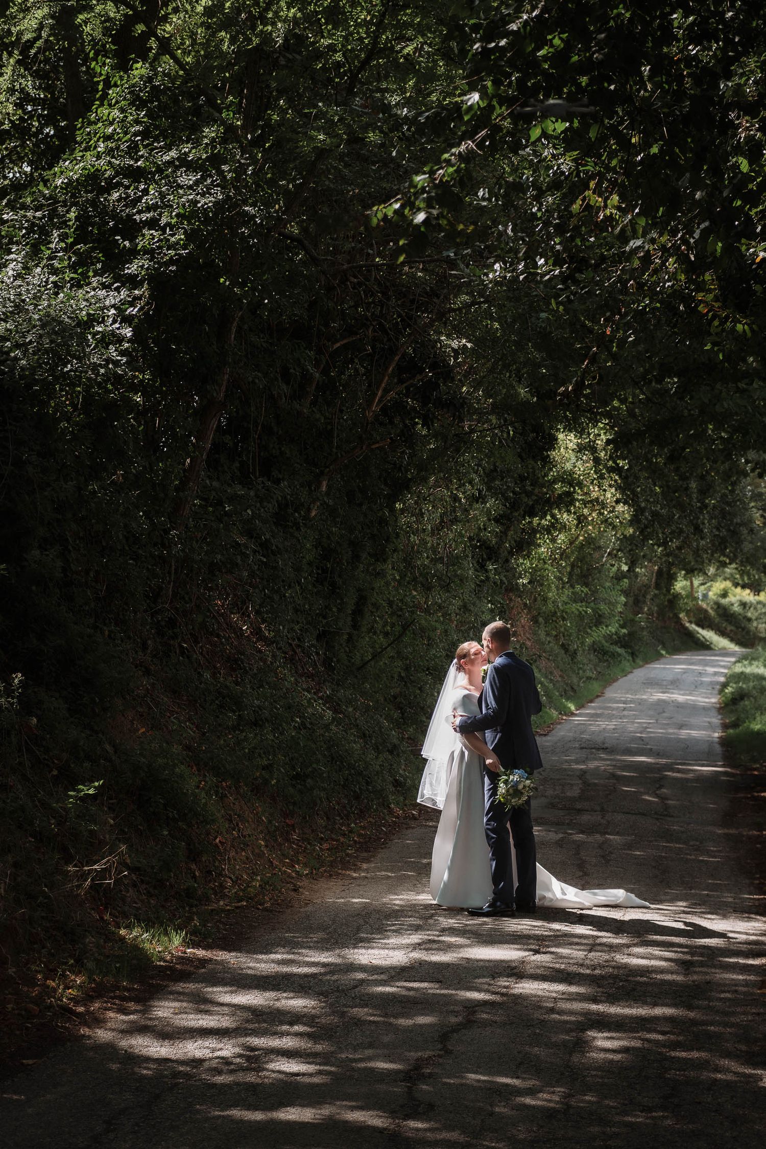 Bride and groom portrait in the countryside of the Marche region, Italy