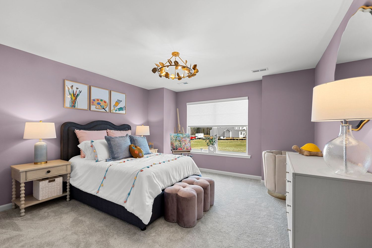 Spacious bedroom with purple walls showcases white bedding, modern furniture, and elegant gold lighting fixtures.
