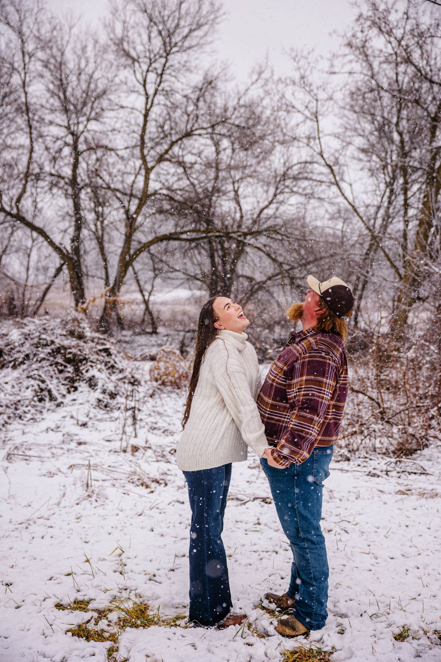 Michigan engagement photographer capturing candid couple moments