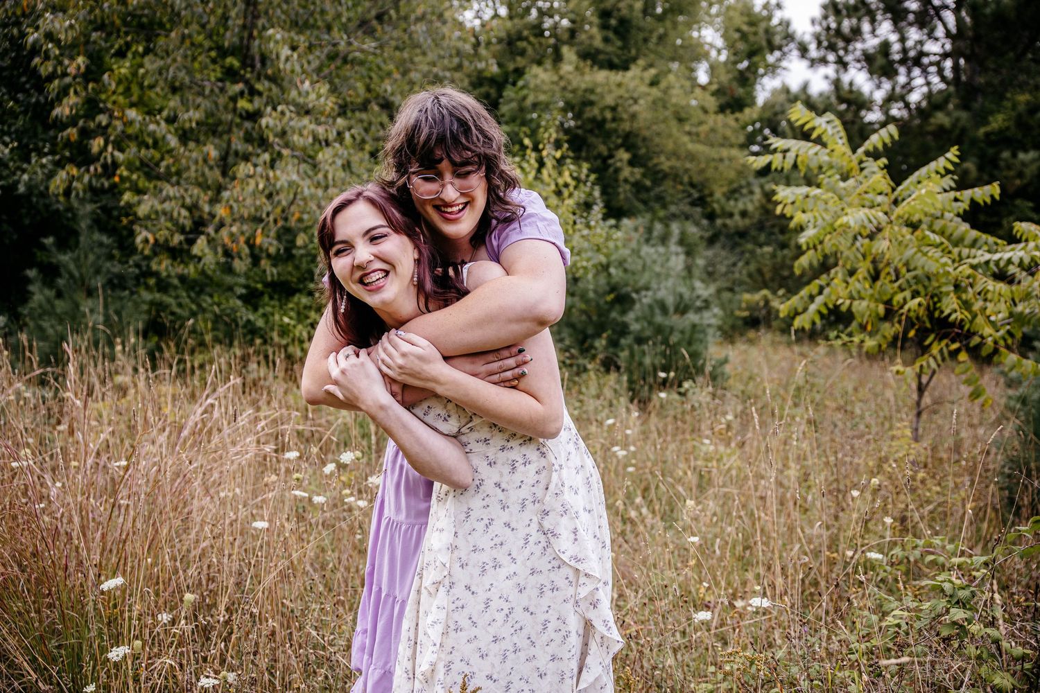 engagement photos in Michigan field at golden hour