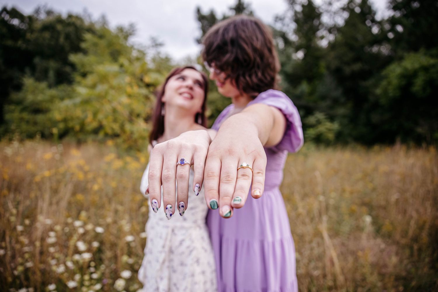 engagement photos in Michigan field at golden hour