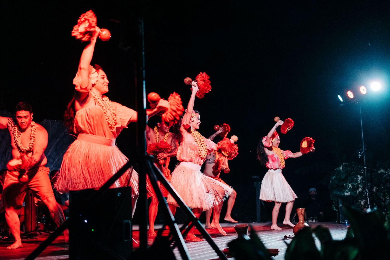 Concert performance with dramatic red lighting and energetic stage presence at Mauna Lani Beach Resort.