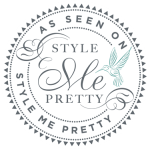 Elegant circular logo for Style Me Pretty with decorative text and hummingbird design.