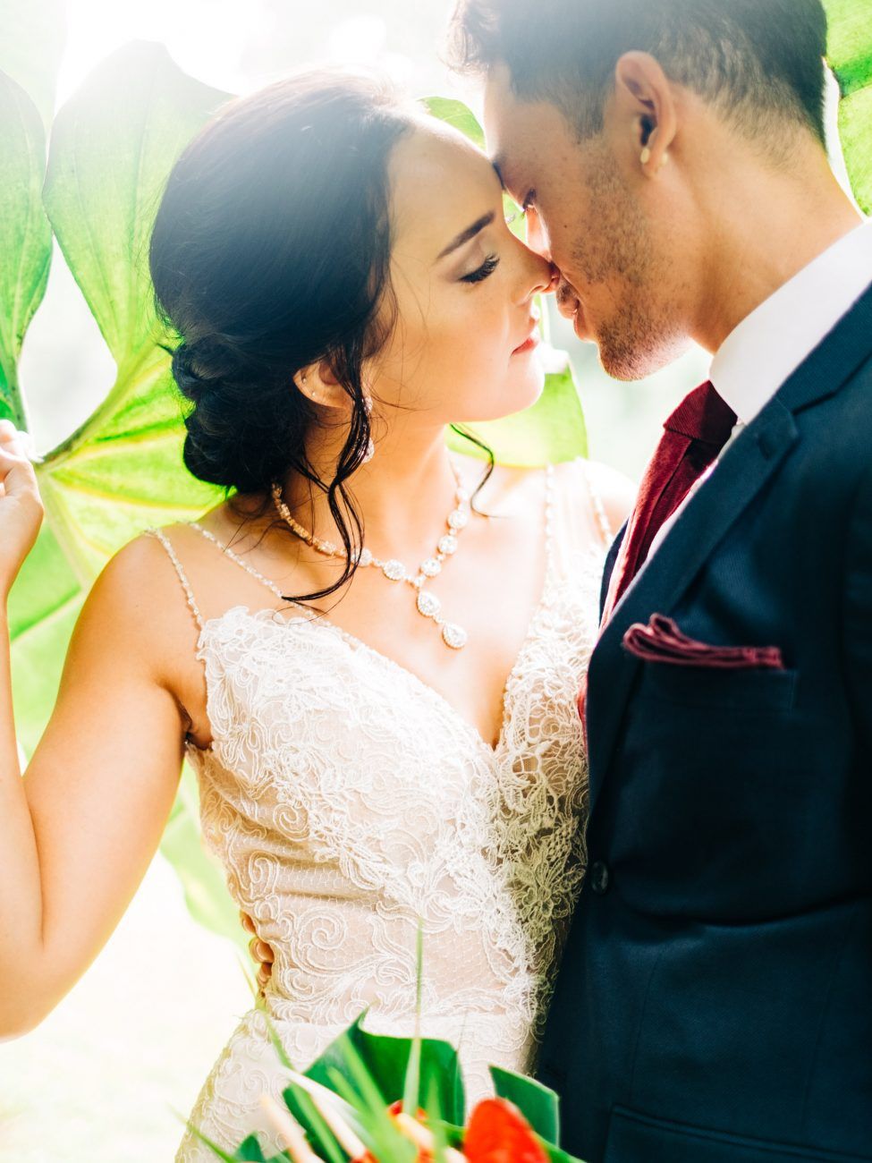 Romantic wedding couple portraits with soft natural lighting and lace details at the Falls at Reeds Island, Hilo, Big Island of Hawaii.