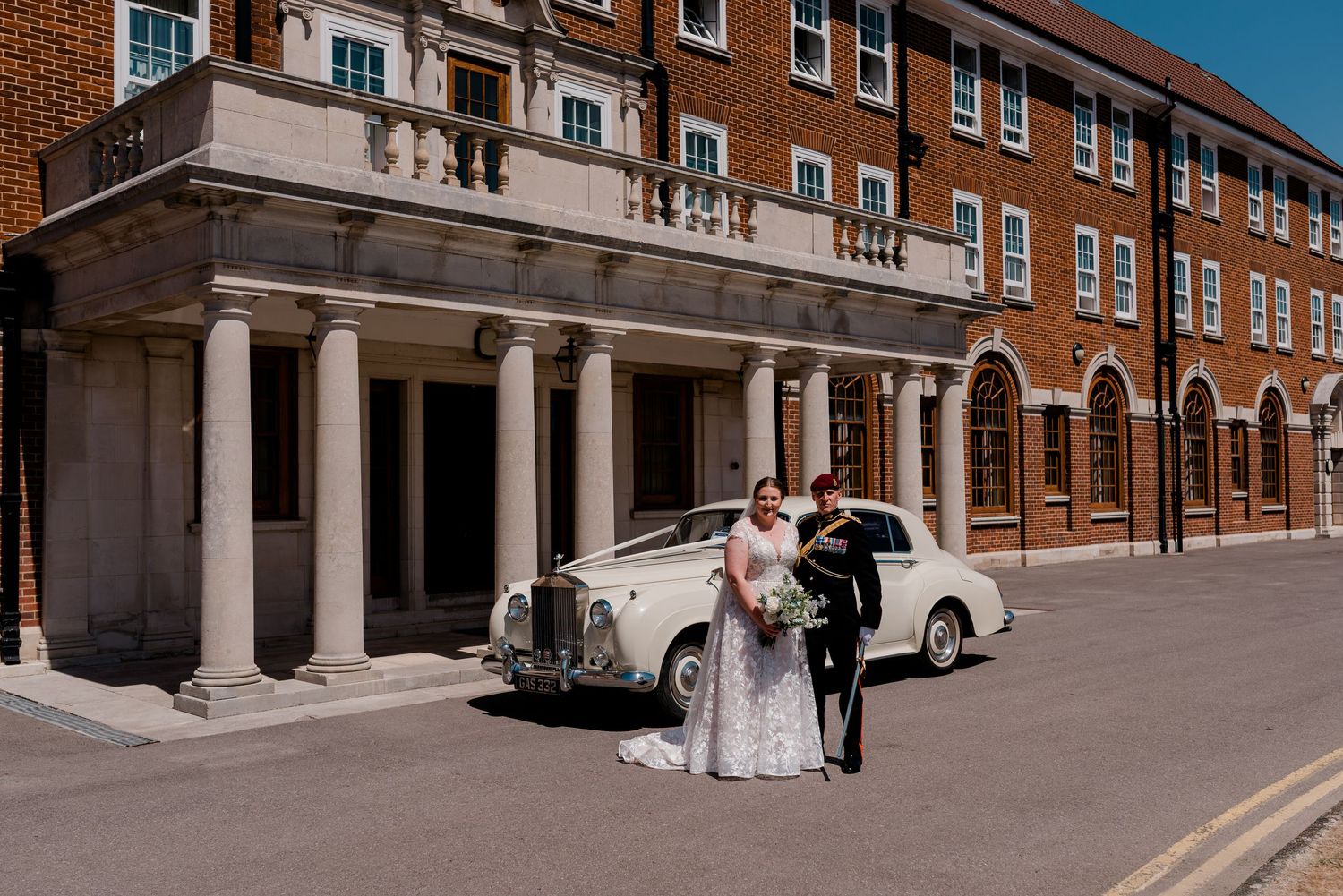 A series of wedding photos taken outside a traditional brick building with elegant columns and architecture.