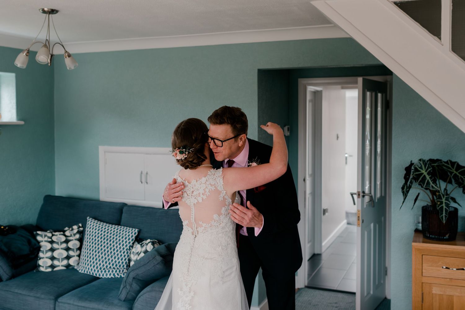 Modern interior space with blue walls showing multiple frames of a romantic dance.