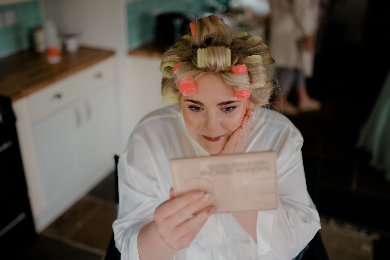 Emotional candid moments captured during a wedding preparation.