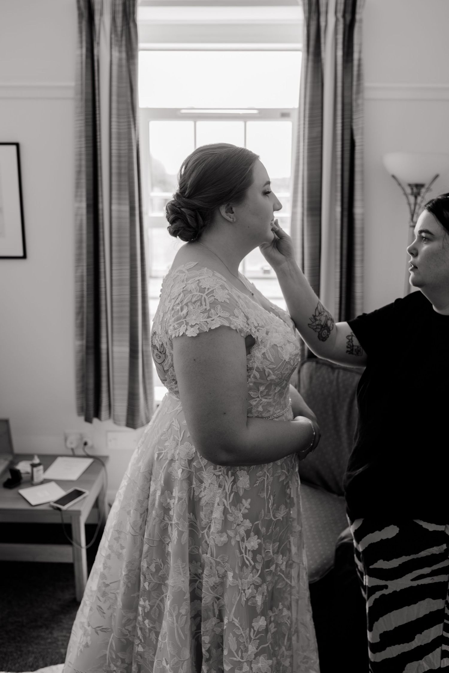 Behind the scenes preparation moments show various wedding dress adjustments in a sunlit room.