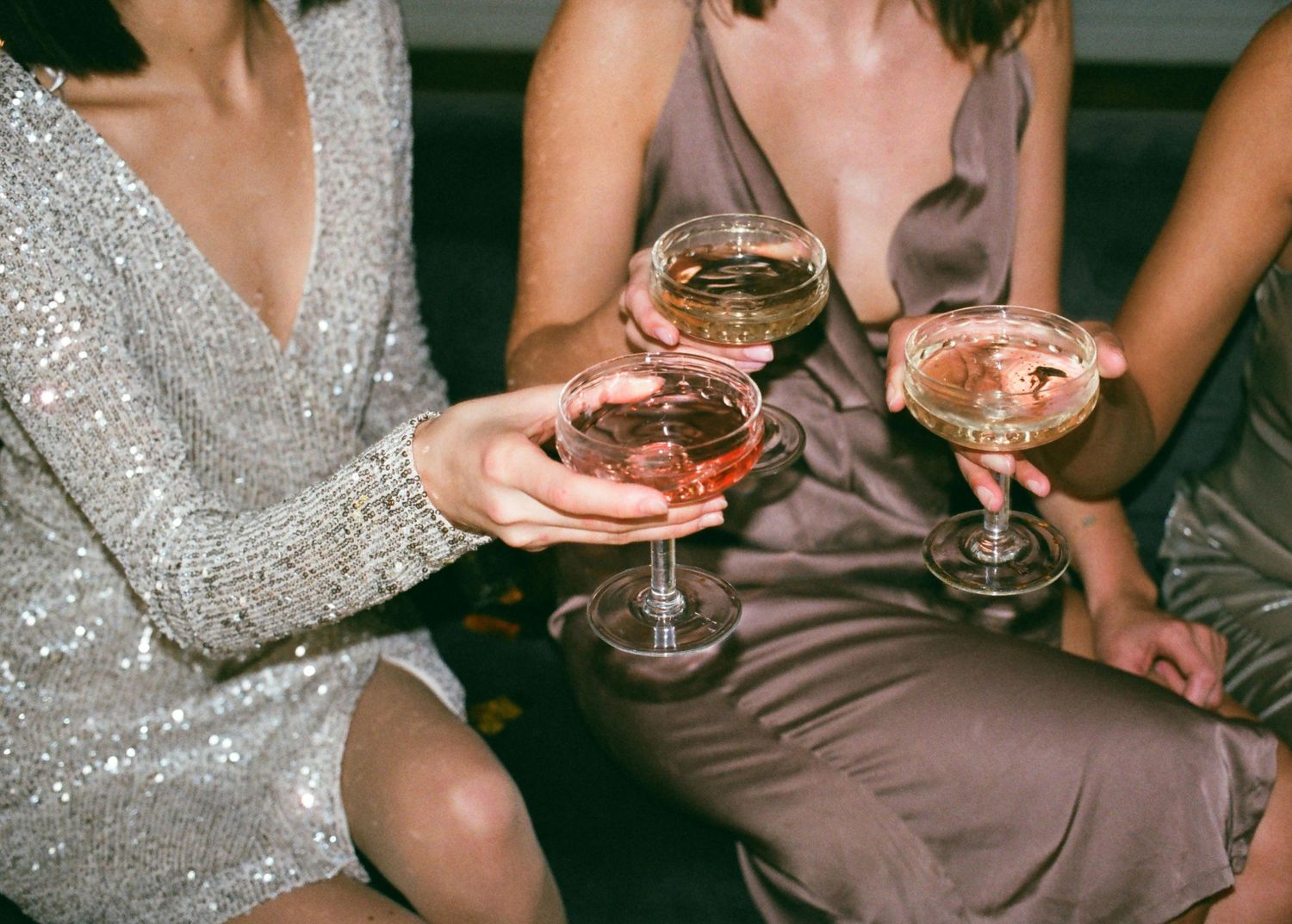 Elegant cocktail party scene with champagne glasses and sparkly dresses.