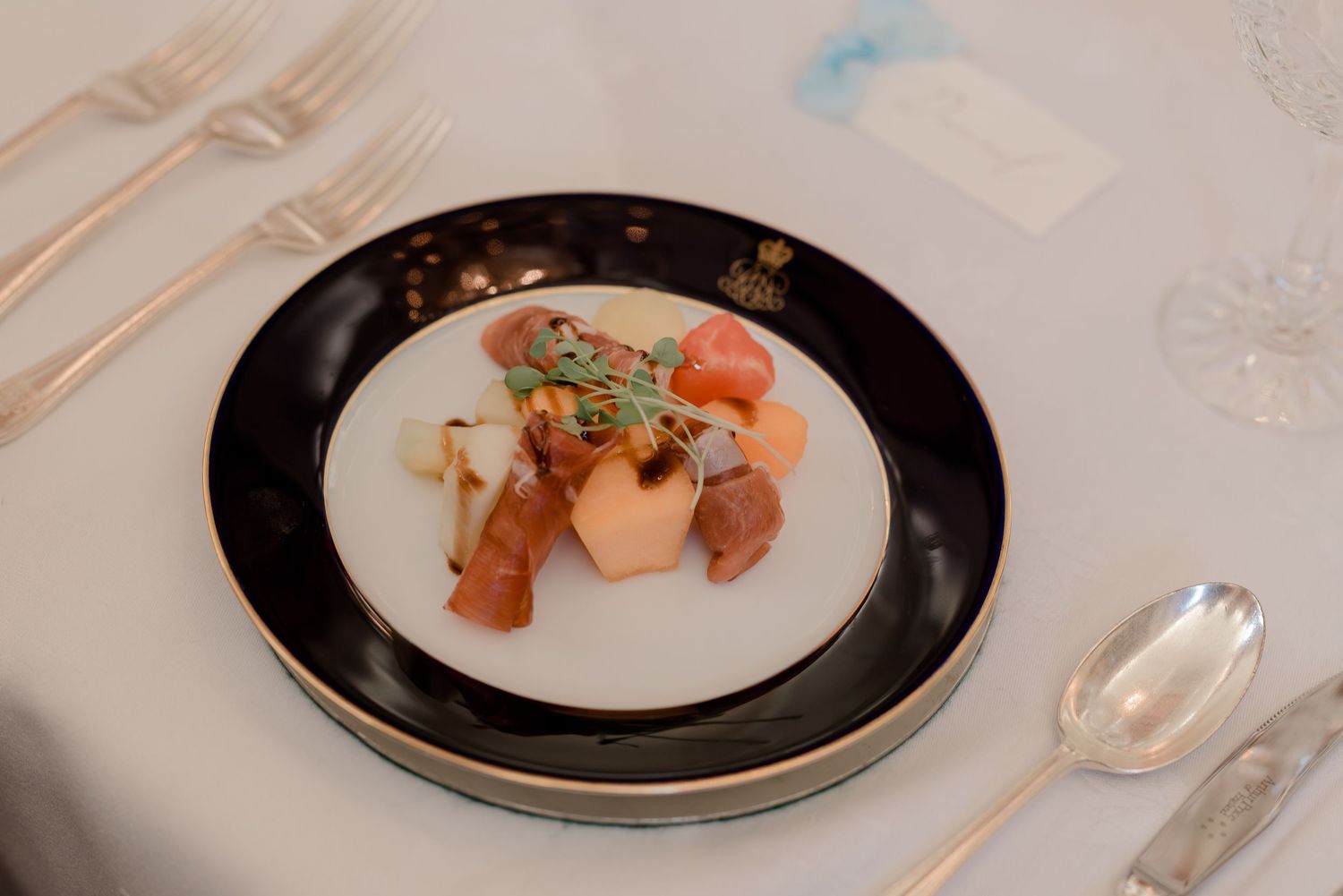 Elegant plated dishes showcase fine dining at wedding reception.