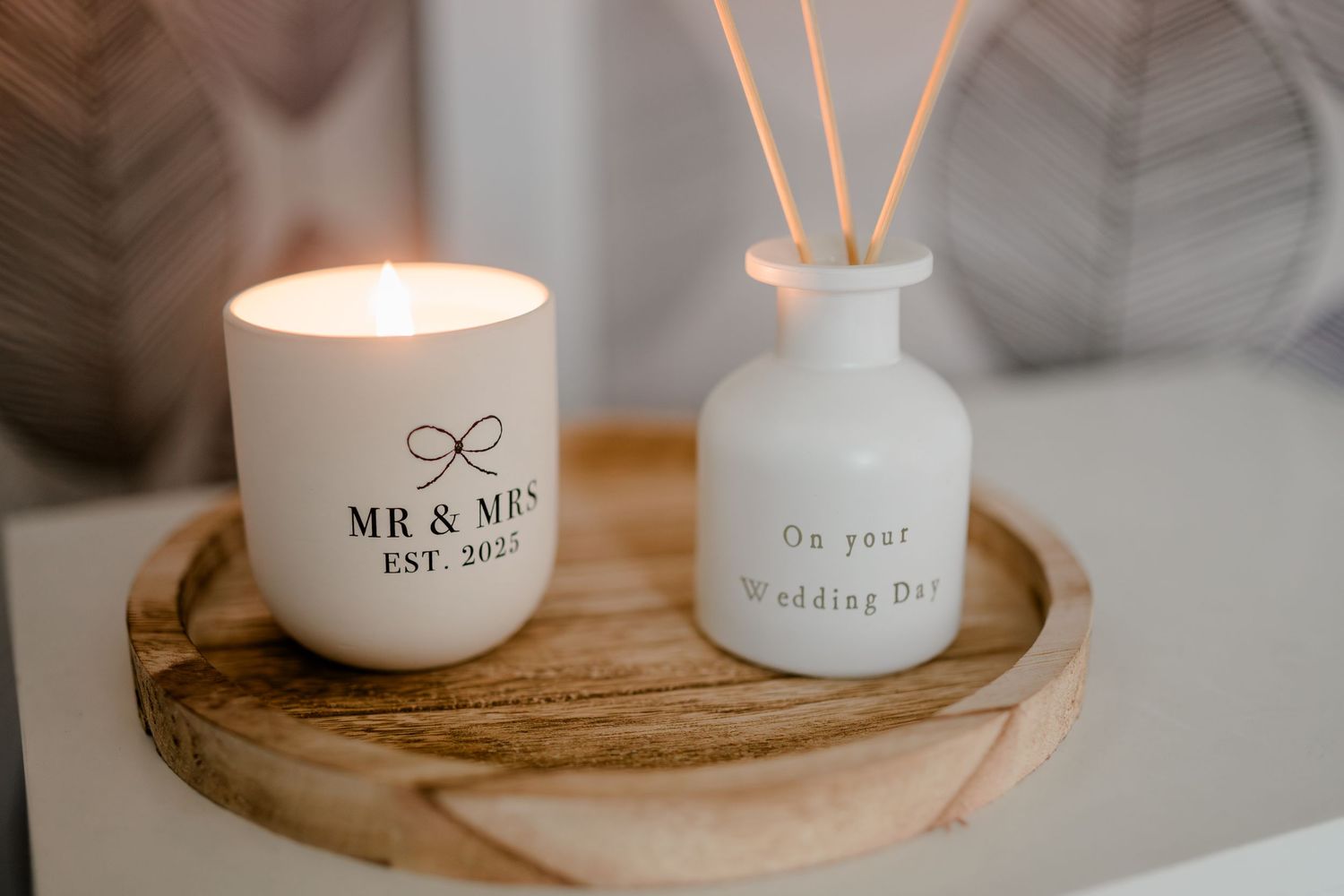 Mr and Mrs wedding day candle and reed diffuser gift set on a wooden tray.
