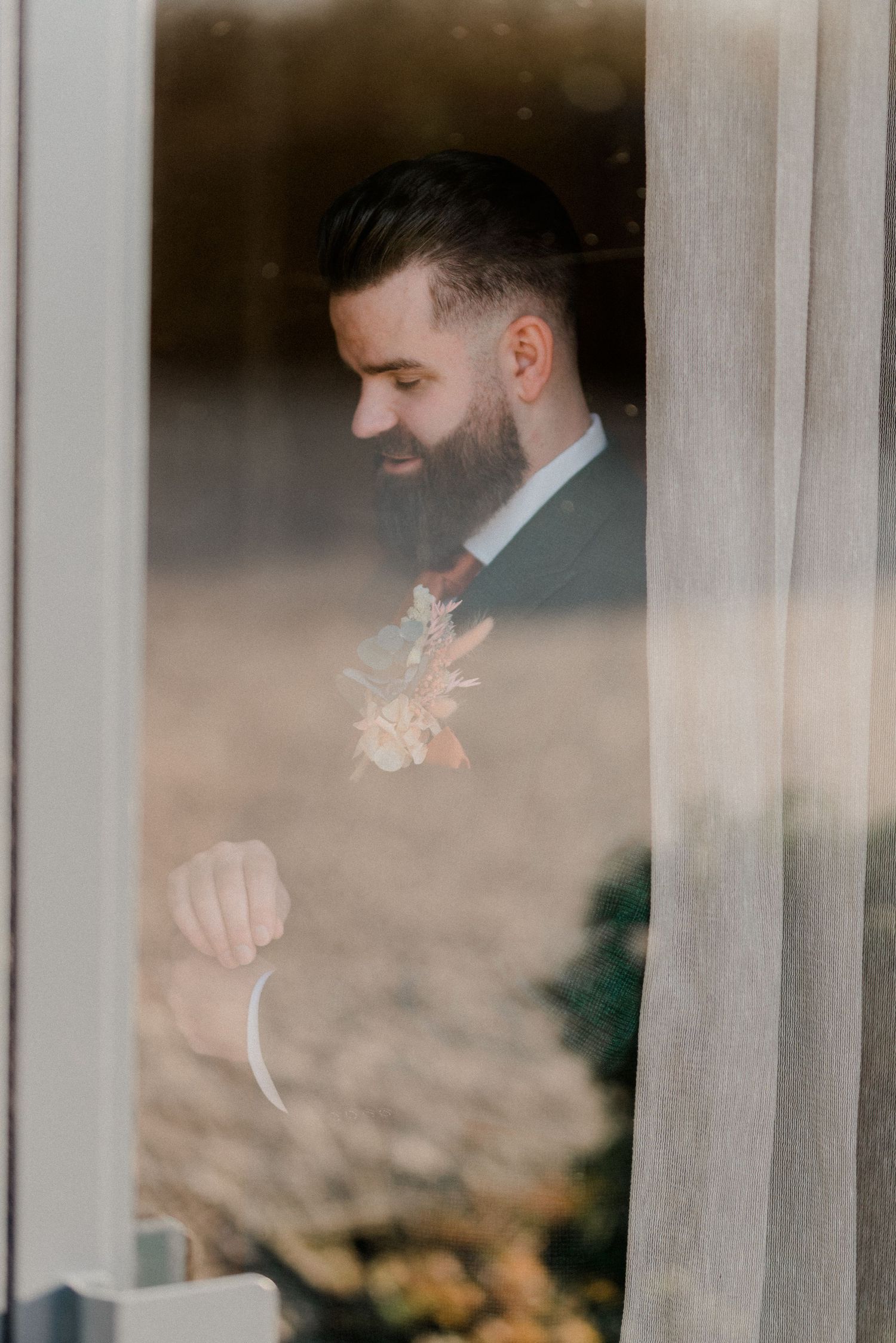 Profile view through window of person with pocket hole.