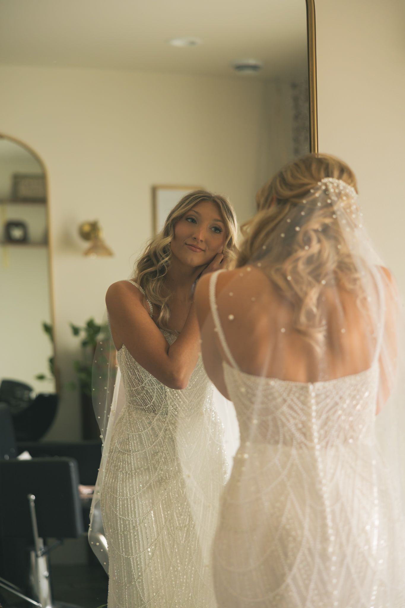 A bride in a shimmering white beaded gown is shown from different angles in a series of wedding preparation photos.