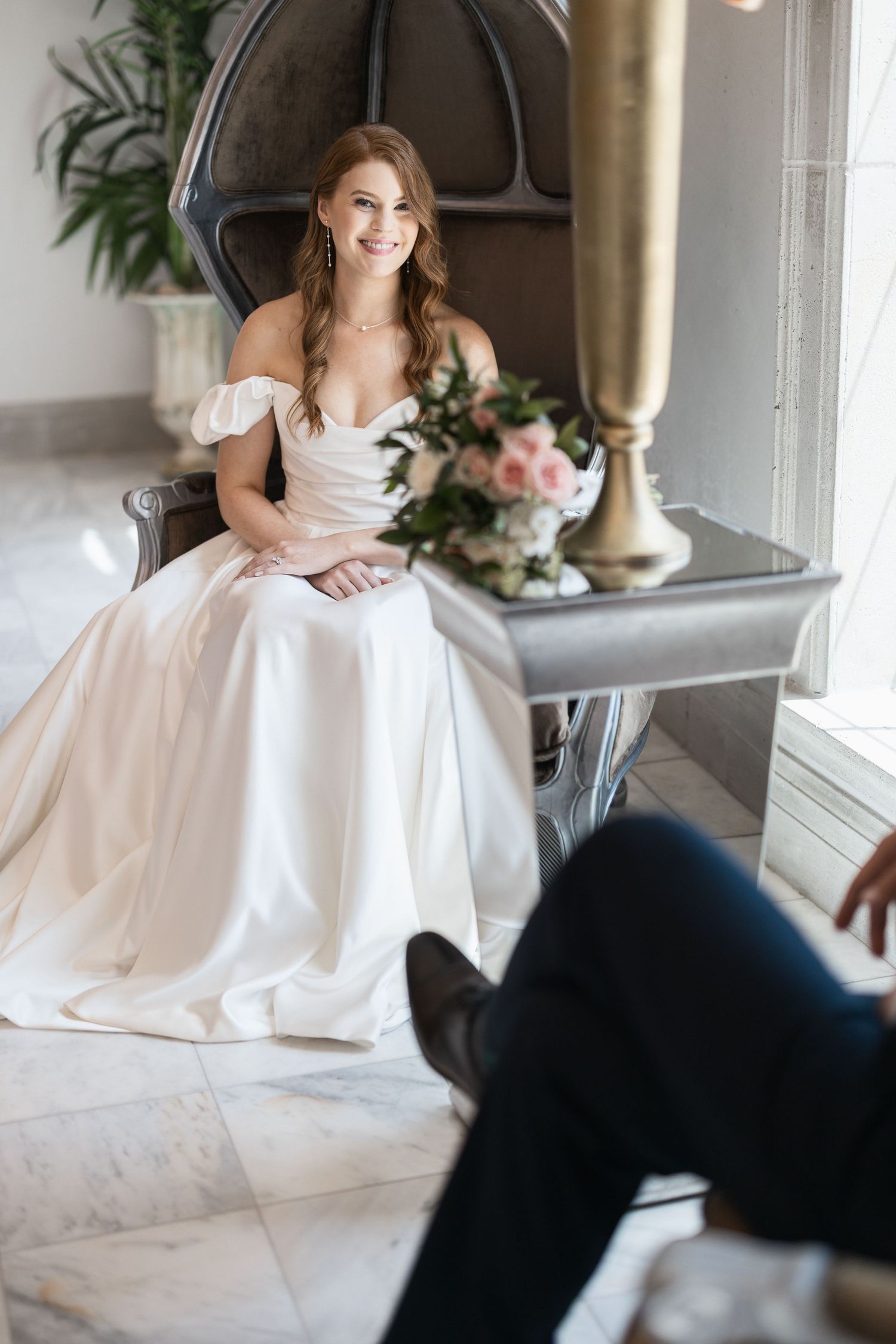 Candid wedding moments photographed in elegant indoor setting with vintage decor.