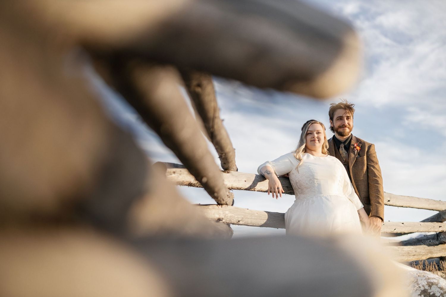Soft focus romantic shots of a couple in a field with dreamy lighting effects.