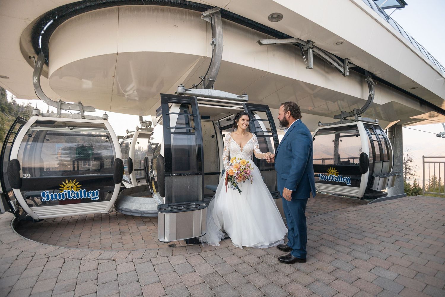 Wide angle shots of ski lift station exterior with wedding couple.