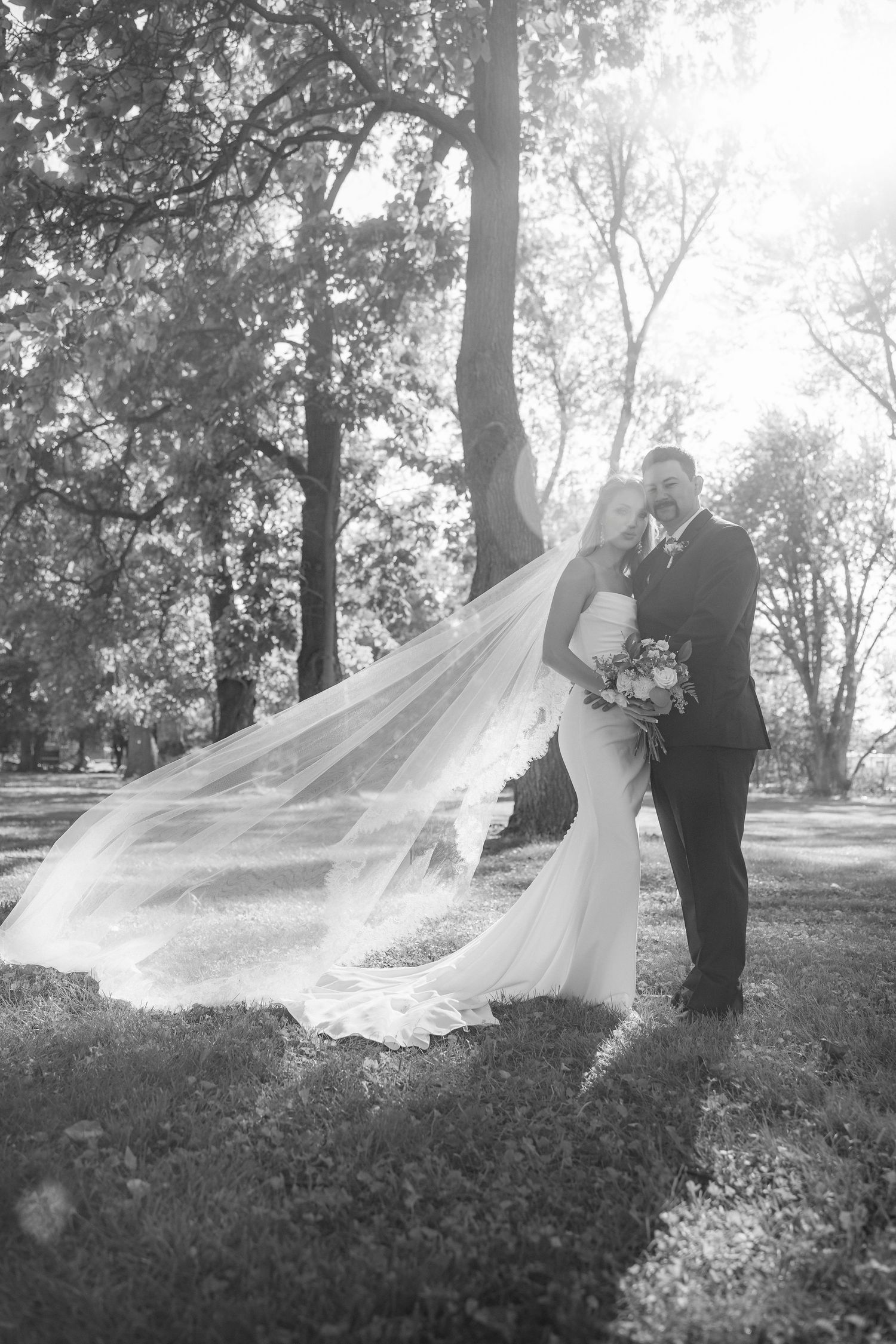 A flowing veil creates dramatic movement in this romantic outdoor photo series.