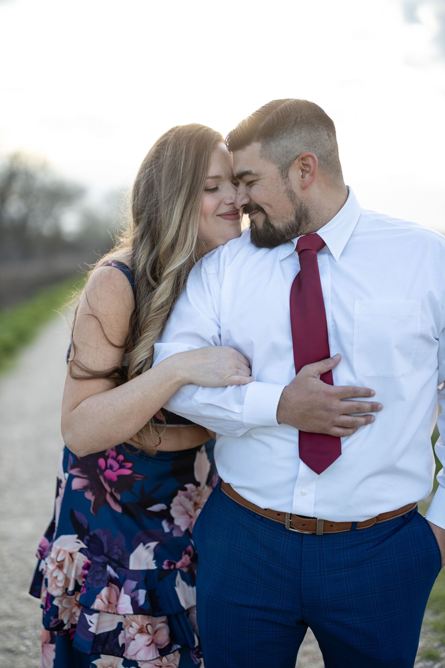Close intimate moment shared between a couple during an outdoor portrait session.