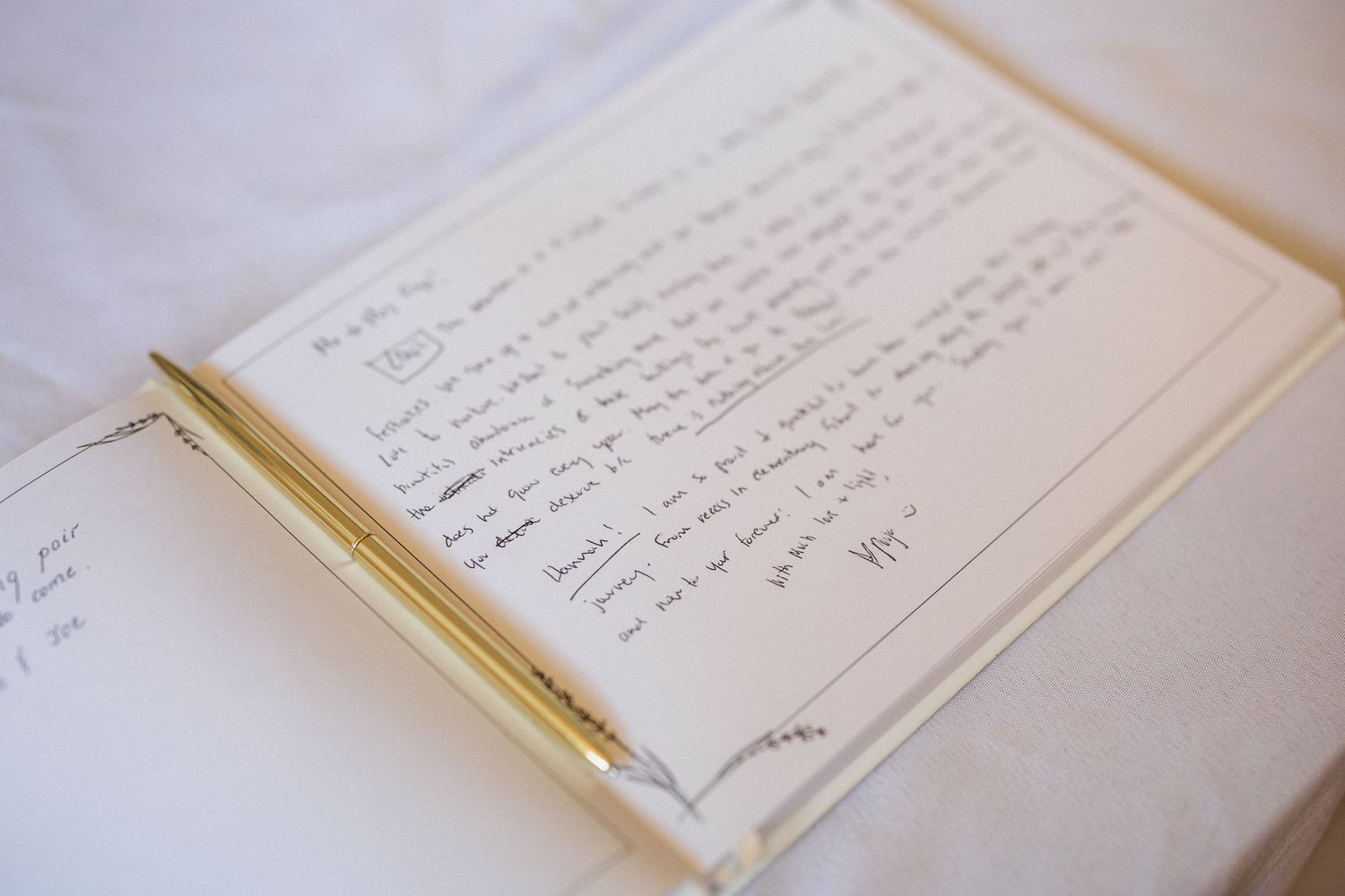 Open guestbook showing handwritten wedding messages and signatures.