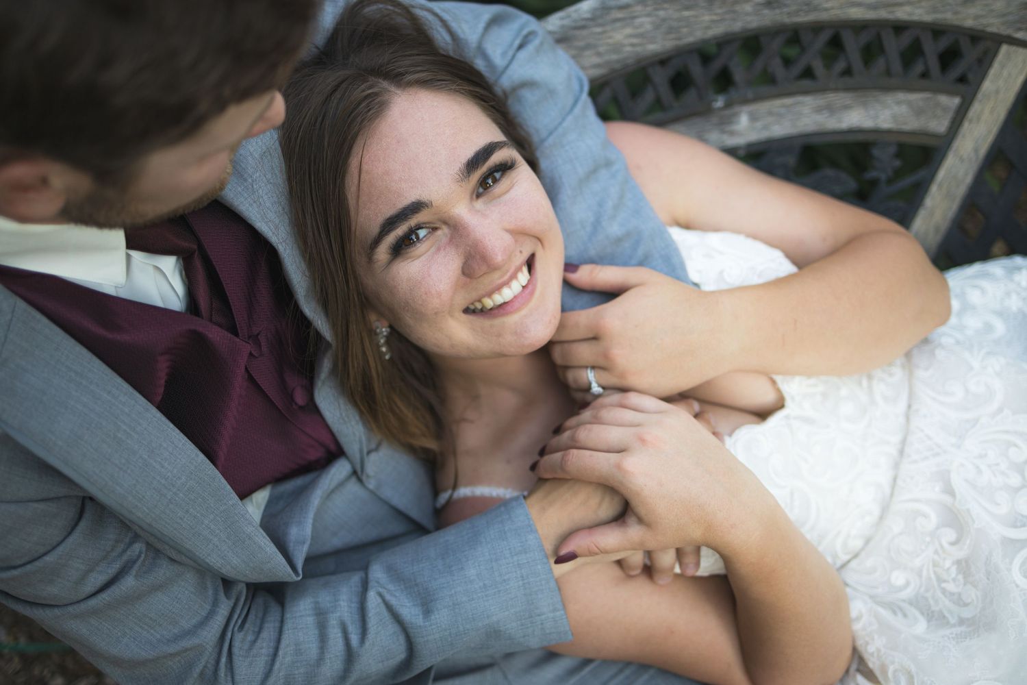 A tender moment between newlyweds sharing a romantic embrace on their wedding day.