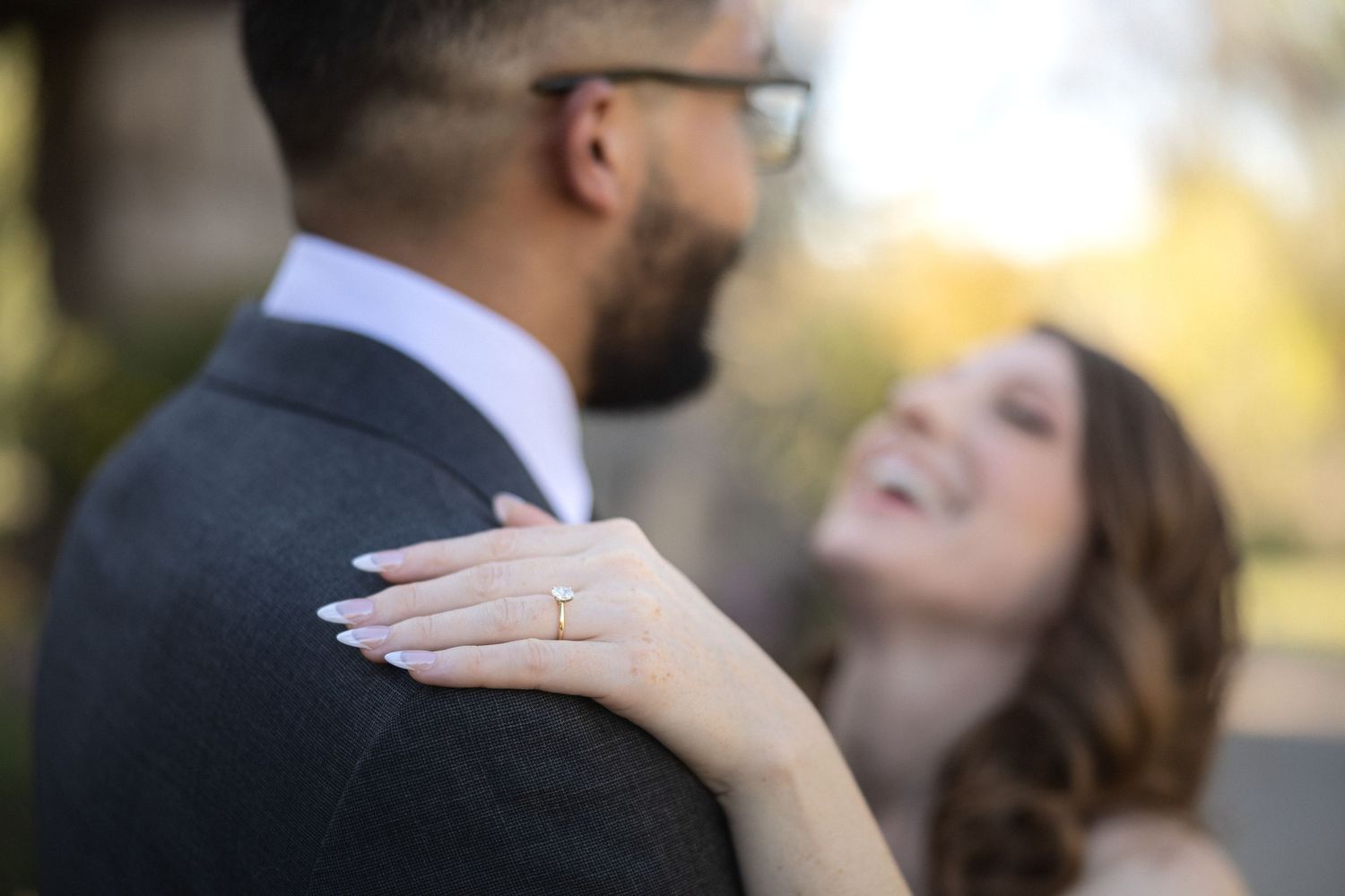 Intimate wedding couple portrait in natural outdoor setting.