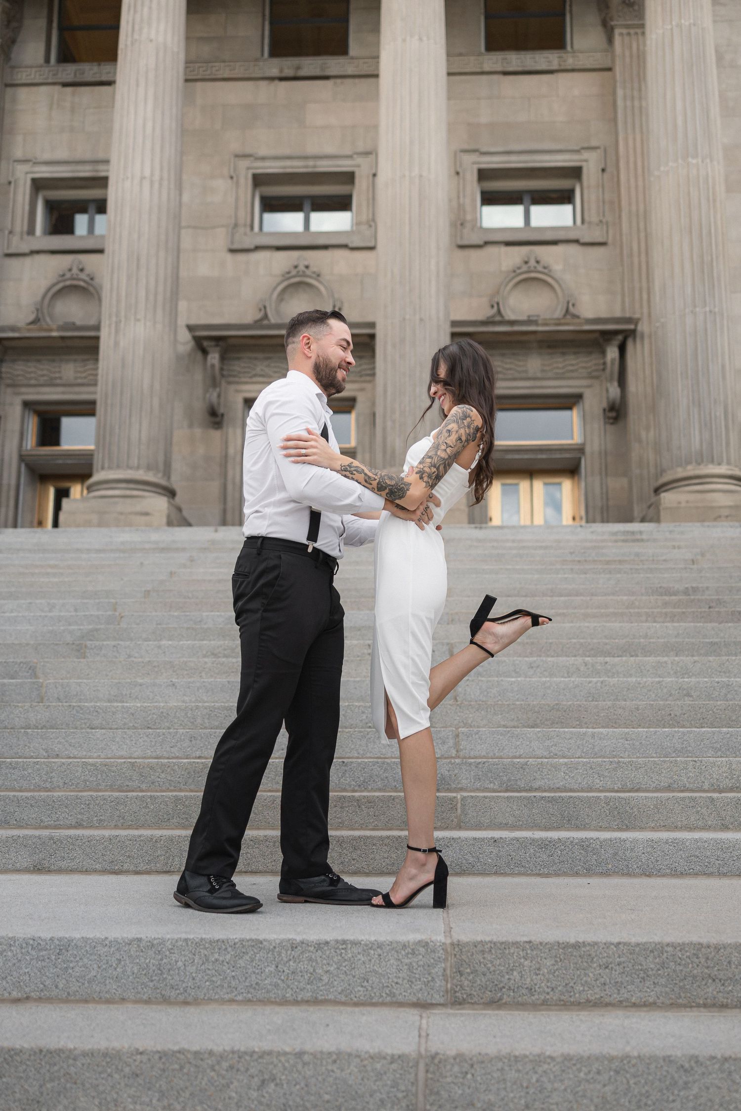 Series of proposal photos on grand stone steps of historic building.