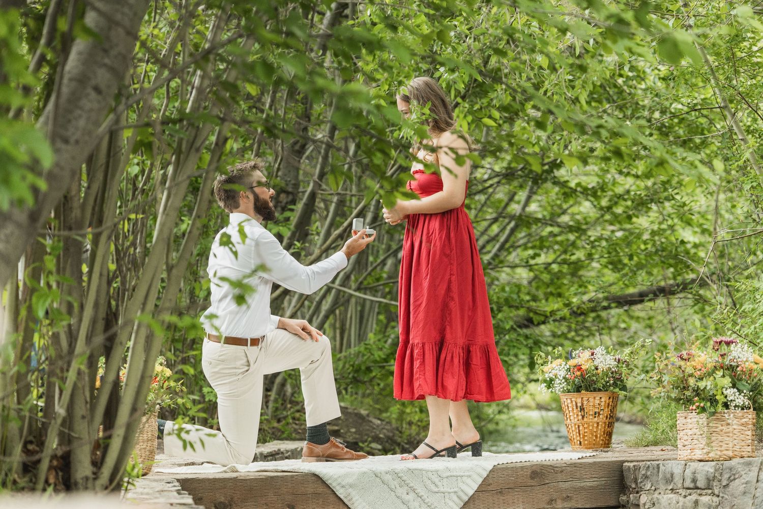 A sequence of outdoor family portraits captured in a lush green forest setting with white wicker furniture.