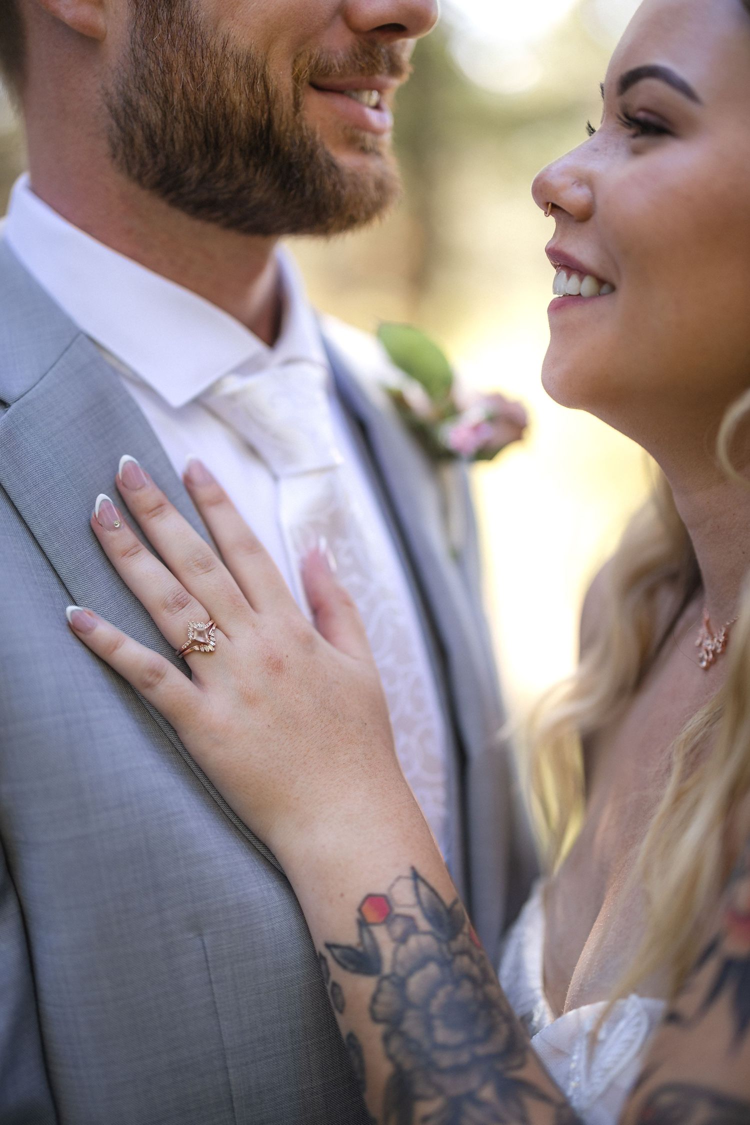 Close-up portrait showing joyful expressions and elegant wedding attire.