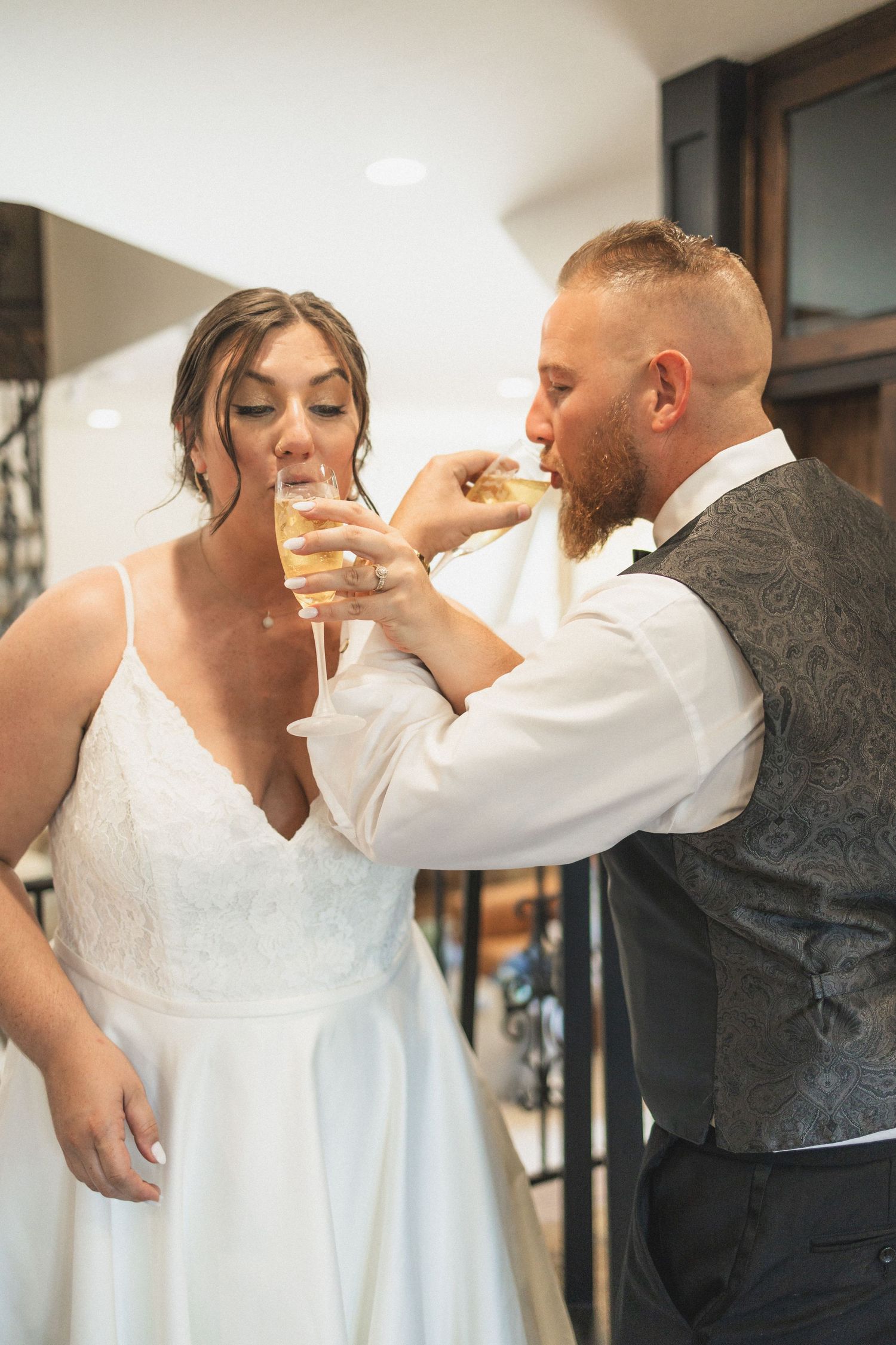 A sweet moment as the couple feeds each other cake during their wedding celebration.