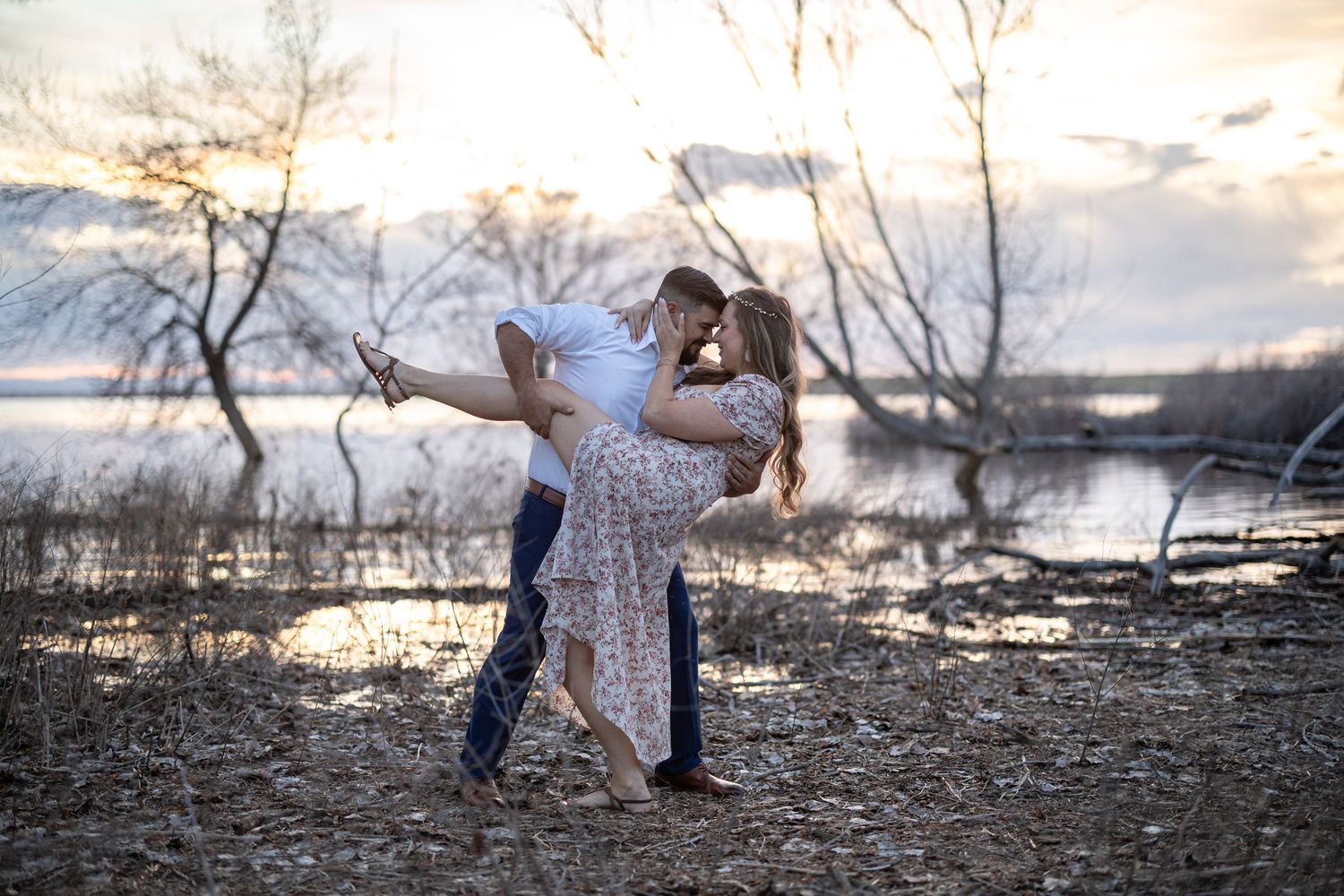 Romantic dance moves shown in silhouette against a waterfront sunset.