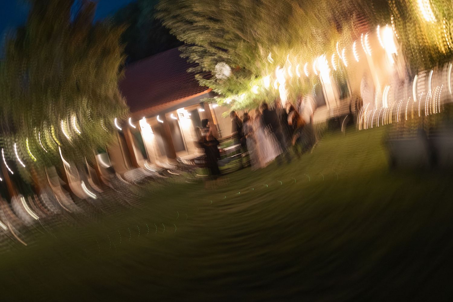 Abstract blurred lights creating a spiral pattern in dark blue tones.