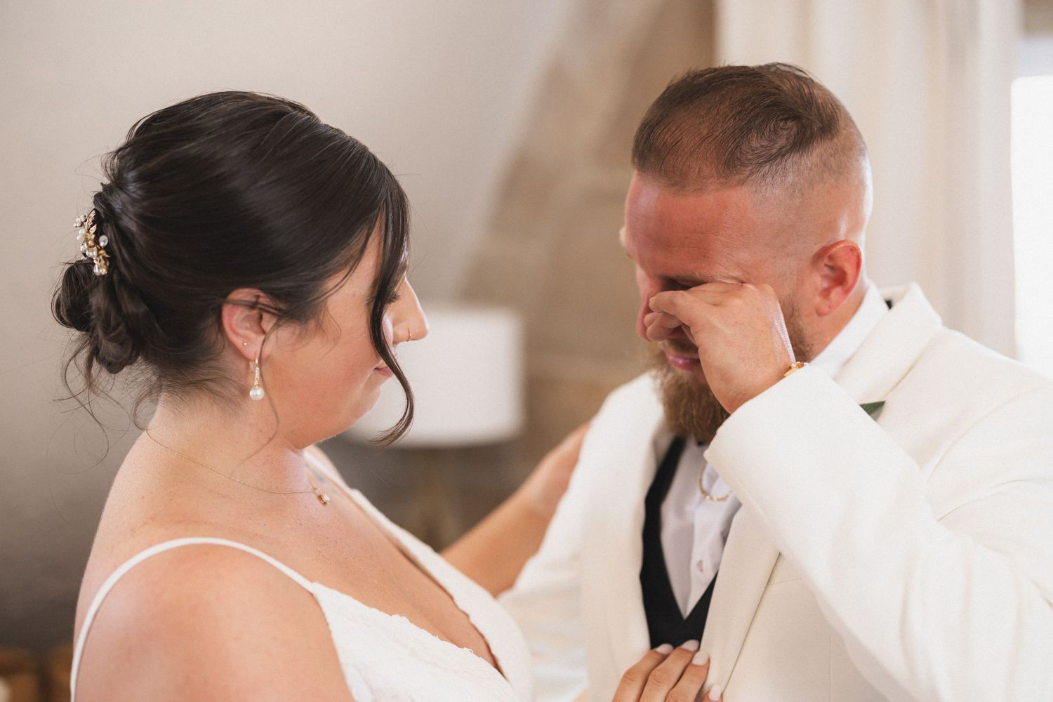 Tender moment captured between newlyweds during their first look.