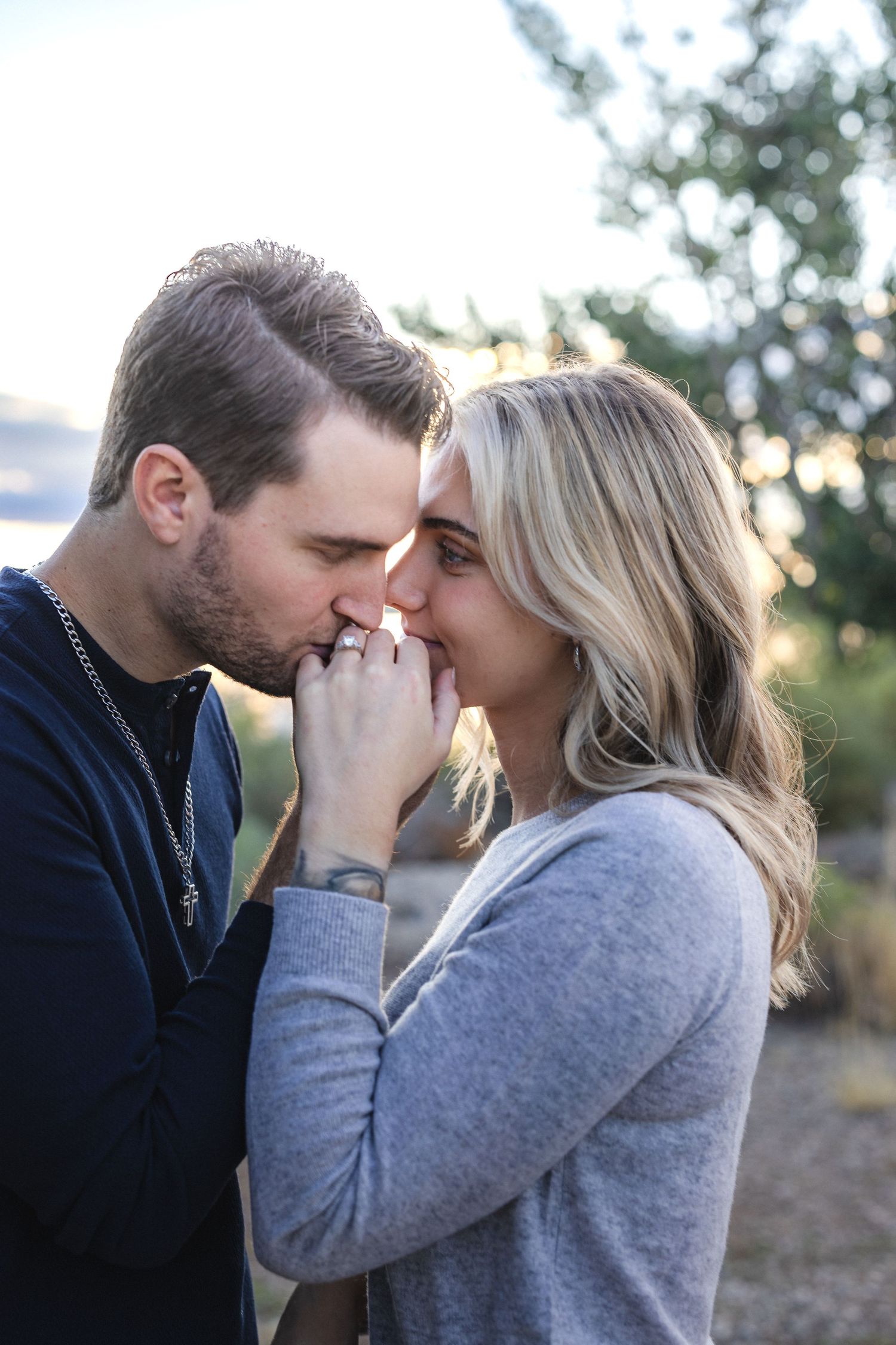 Intimate moment captured during golden hour with soft natural lighting.