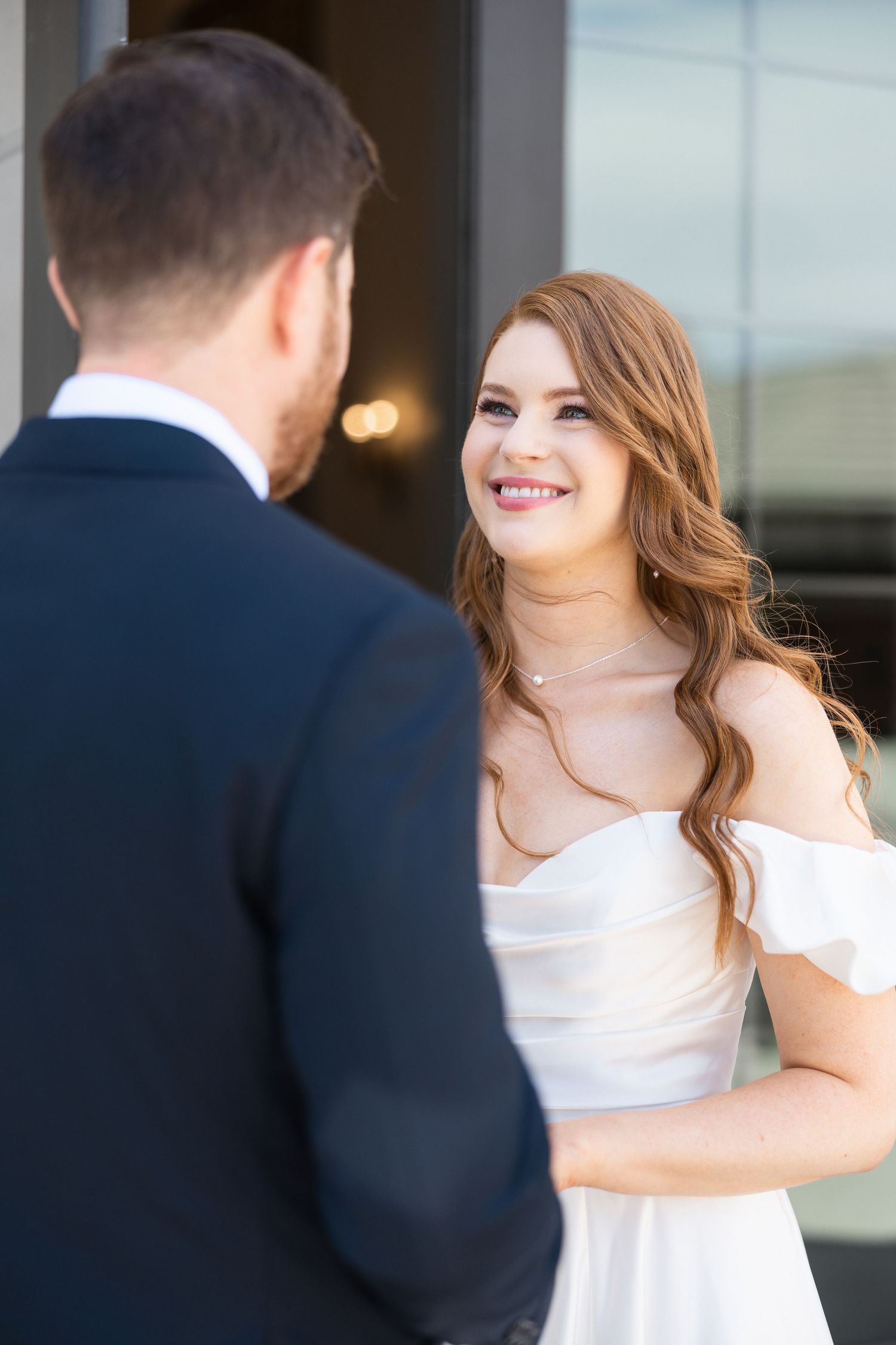 Candid sequence shows couple's genuine reactions during wedding first look.