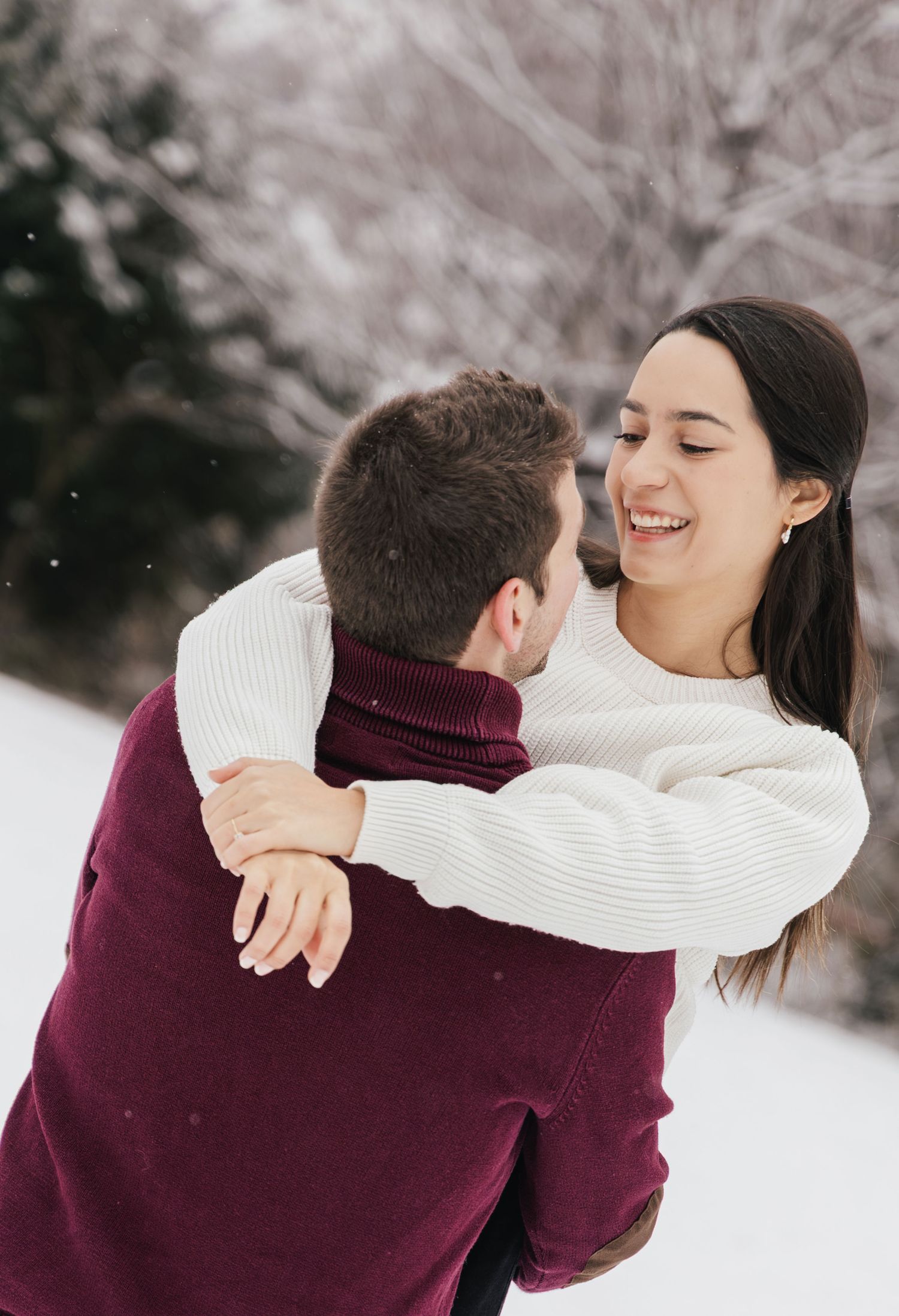 Romantic couple in the snow during a winter couples photoshoot in Switzerland.