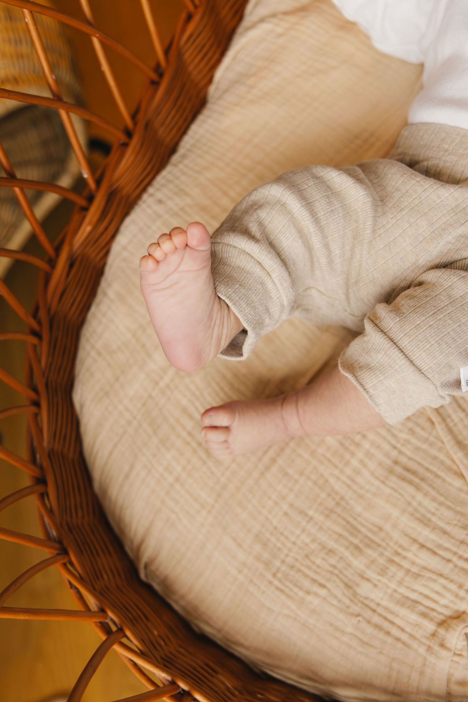 Close-up of a newborn baby’s tiny foot during a lifestyle newborn photoshoot.