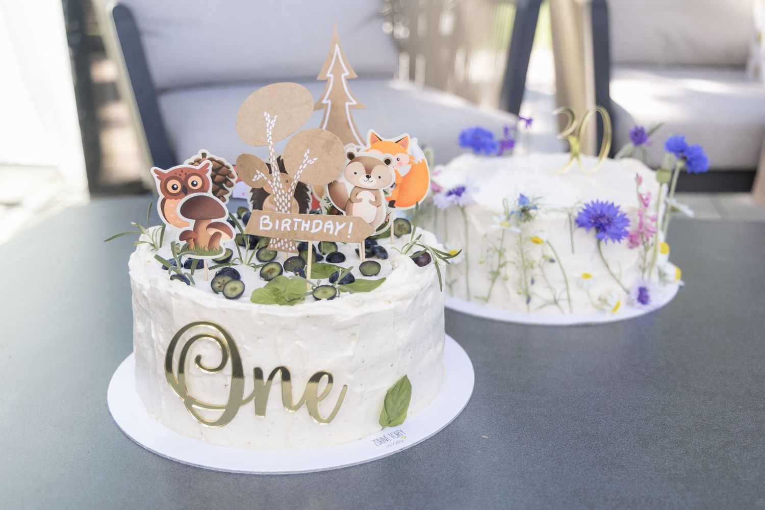 Birthday cakes and sweet details photographed during a birthday celebration.