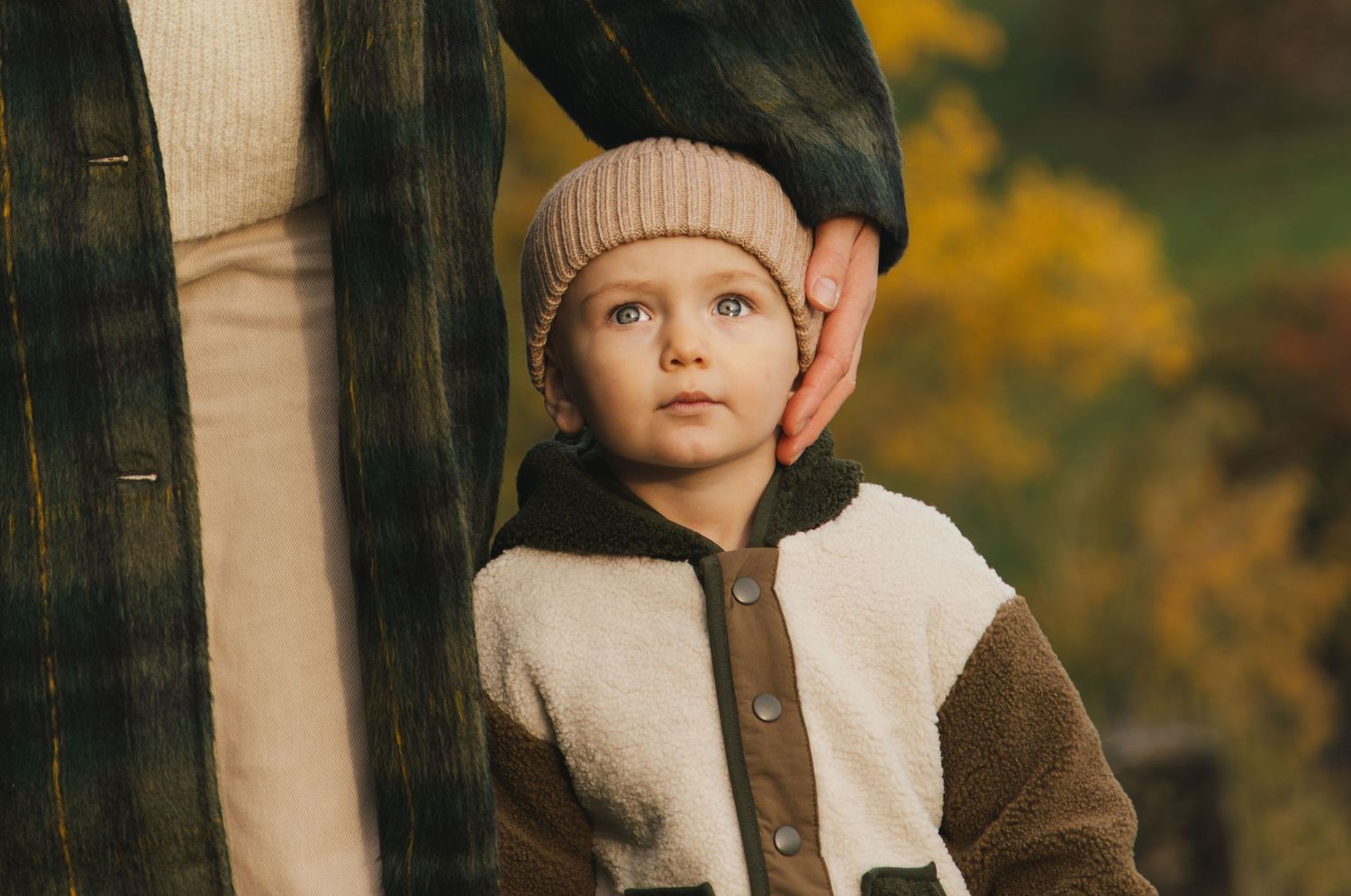 Portrait of a young boy during an autumn family photoshoot in nature in Switzerland.
